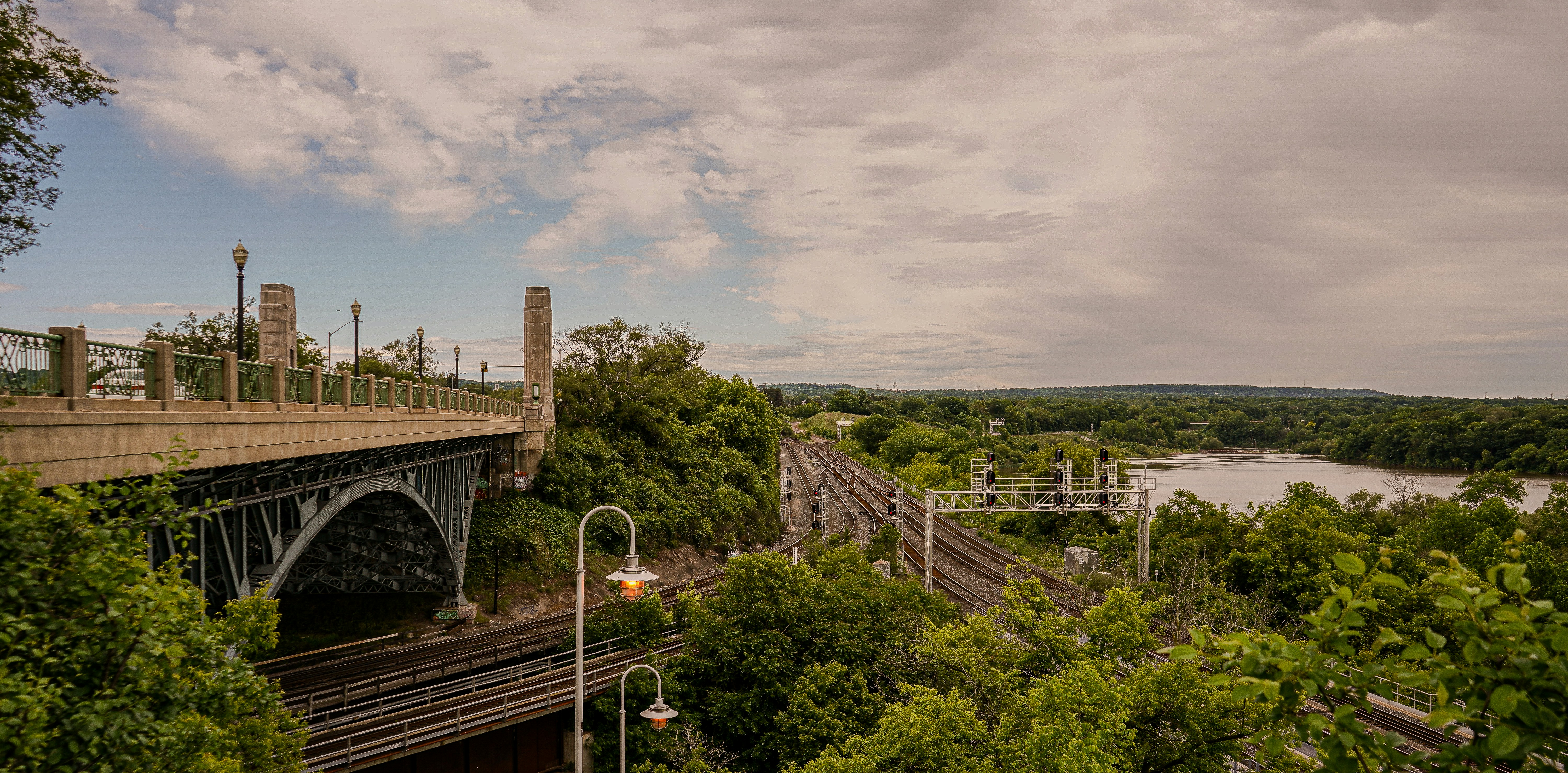 a train traveling over a bridge over a river