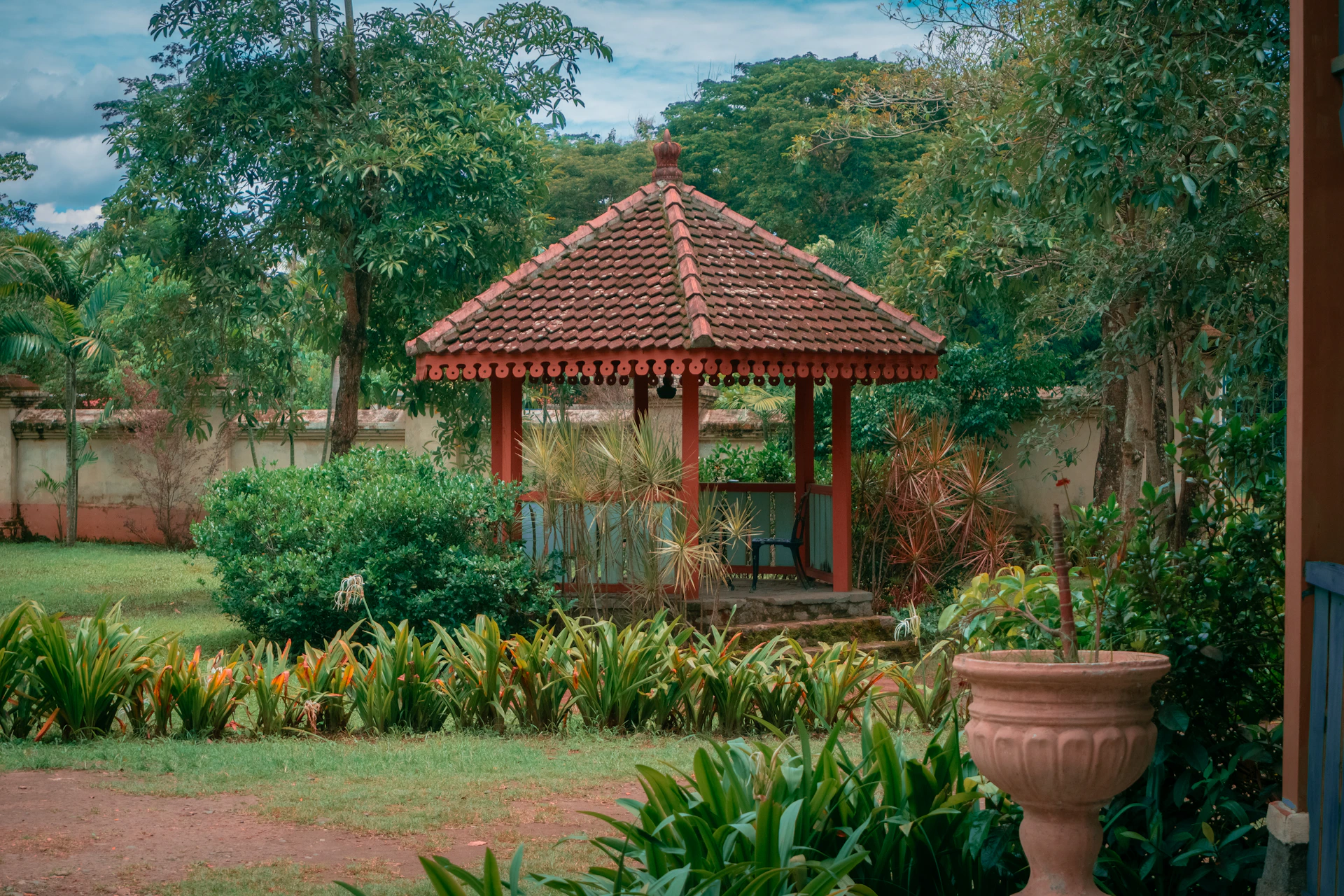 a gazebo in the middle of a garden