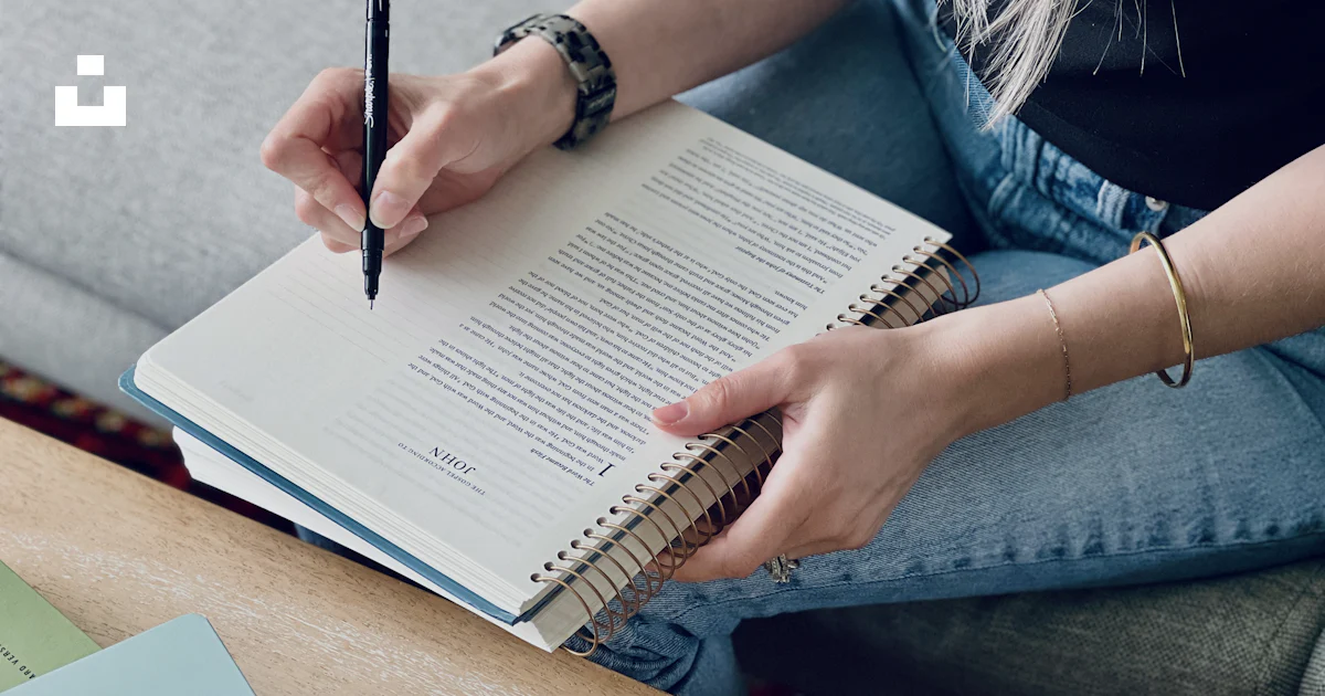 Couch Write A woman sitting on a couch writing on a notebook photo – Free ...