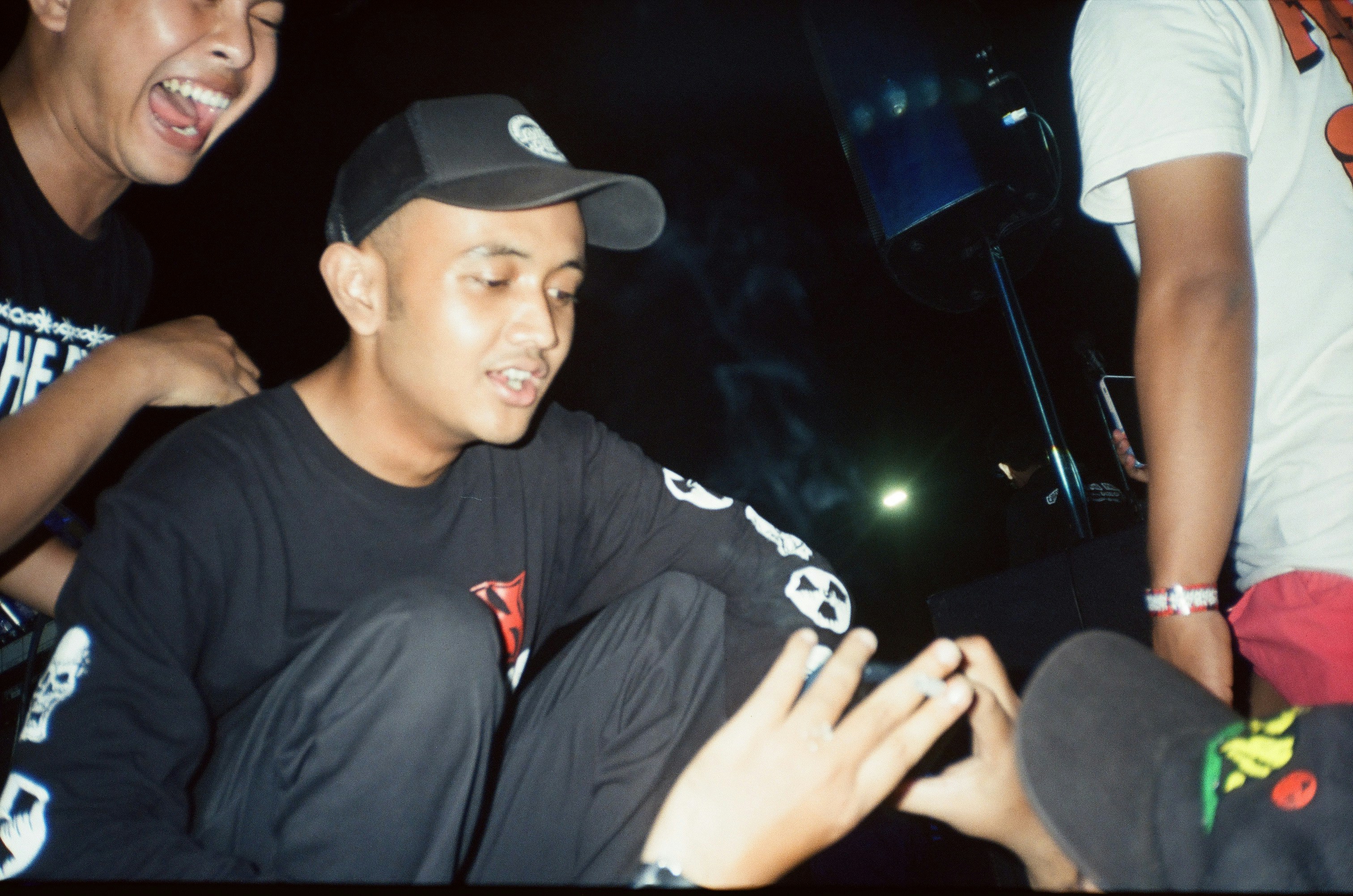 a group of young men sitting next to each other