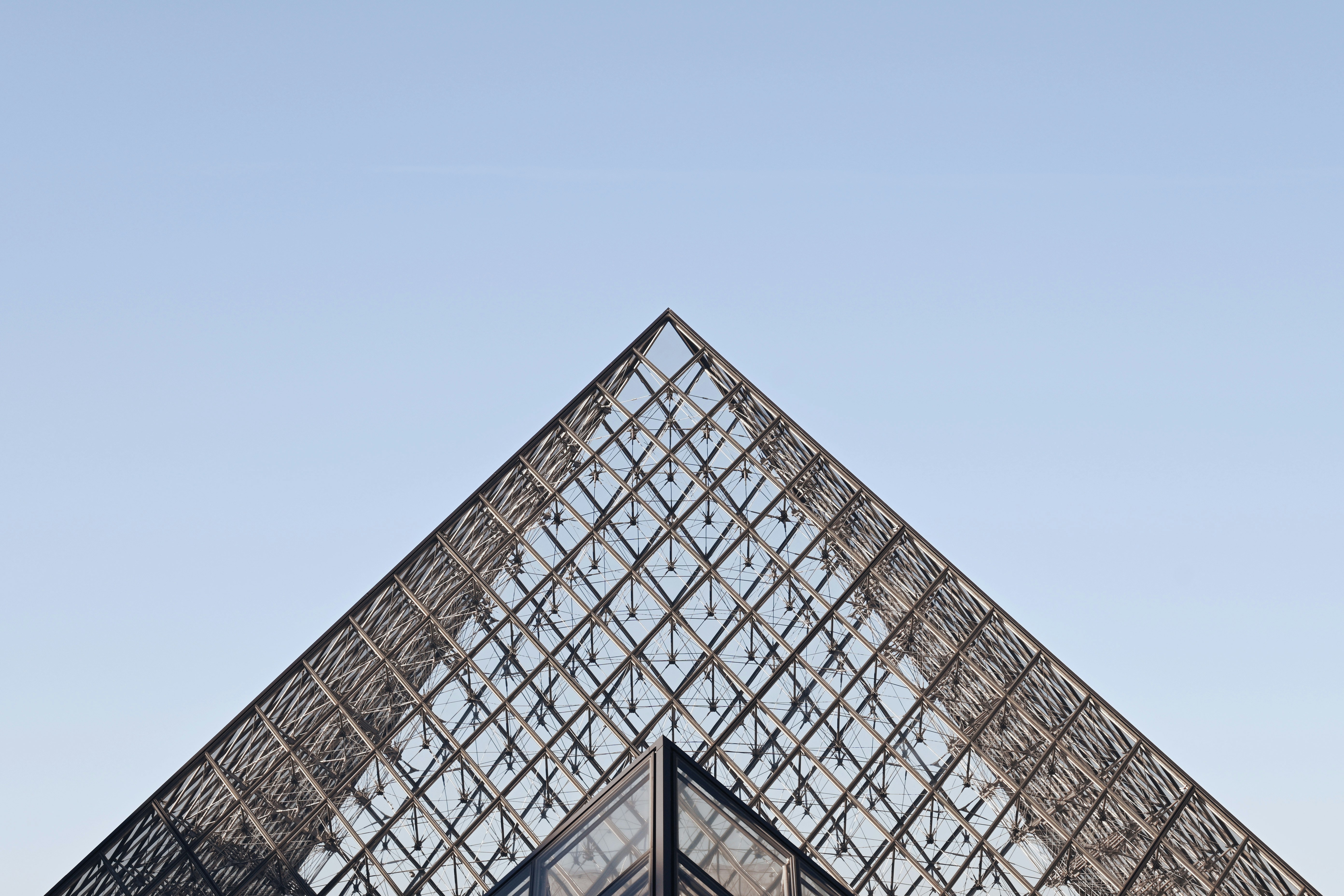 A very tall glass pyramid with a sky background photo – Free Travel ...