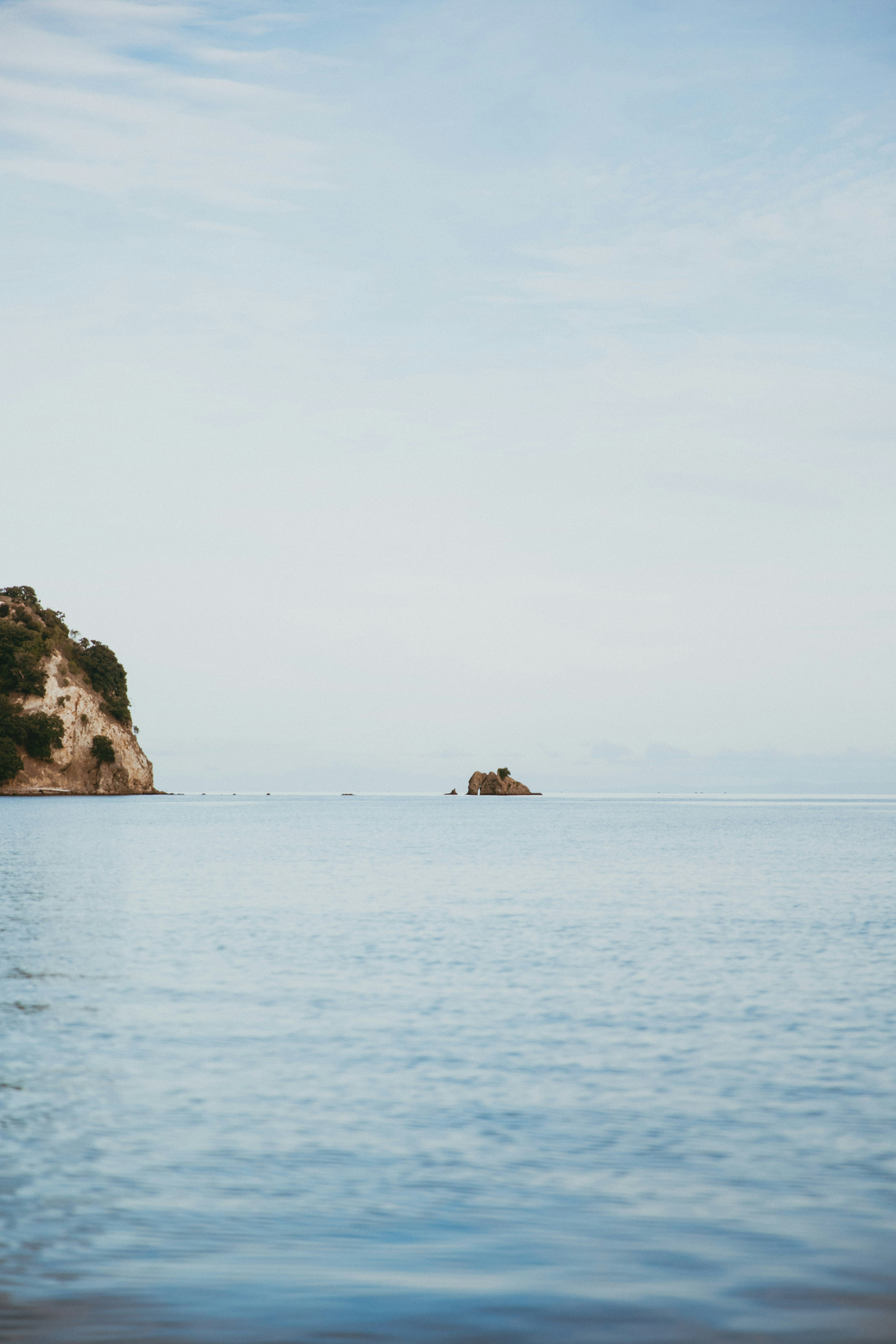 a small island in the middle of a large body of water