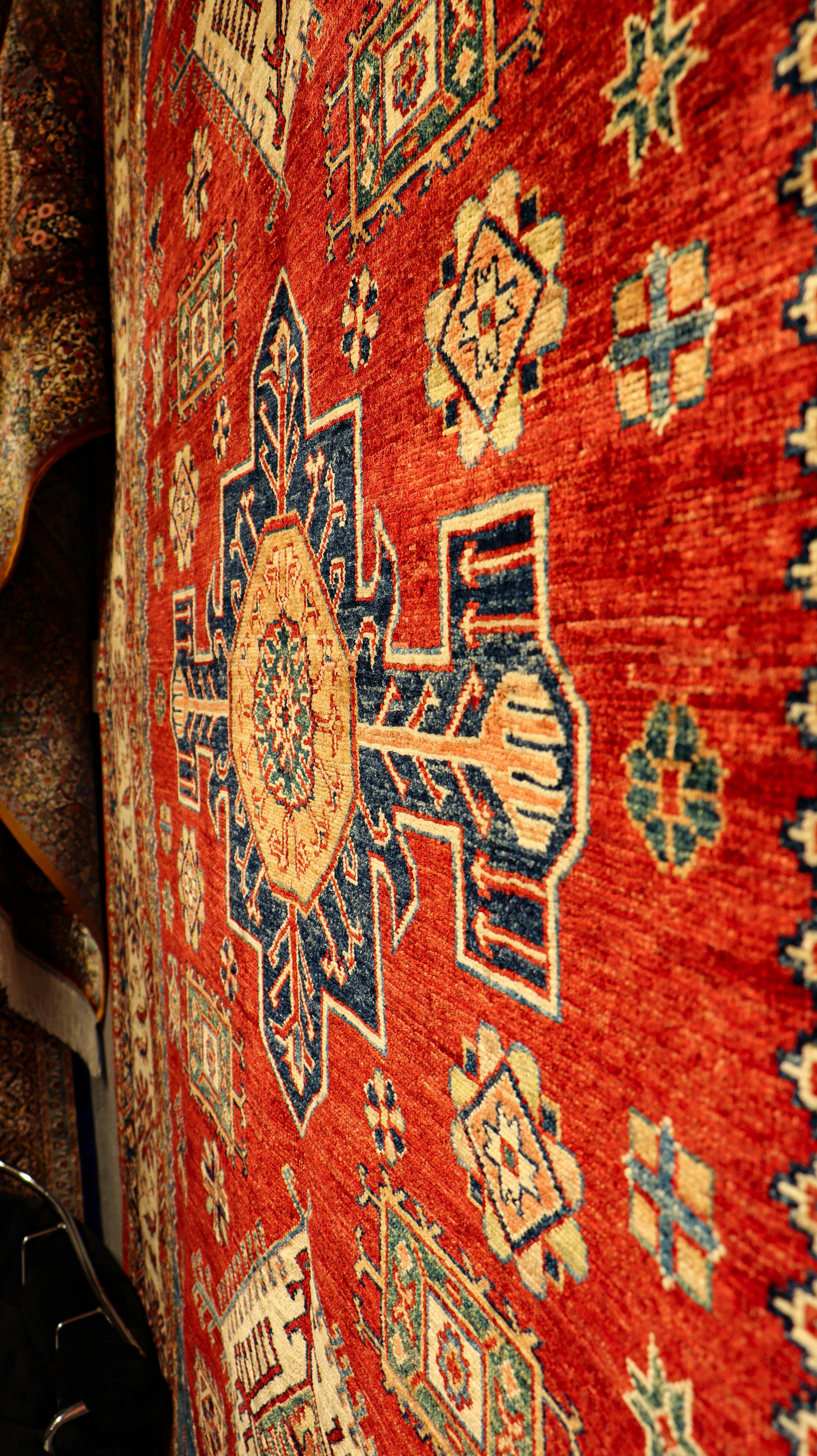 a close up of a rug on a wall