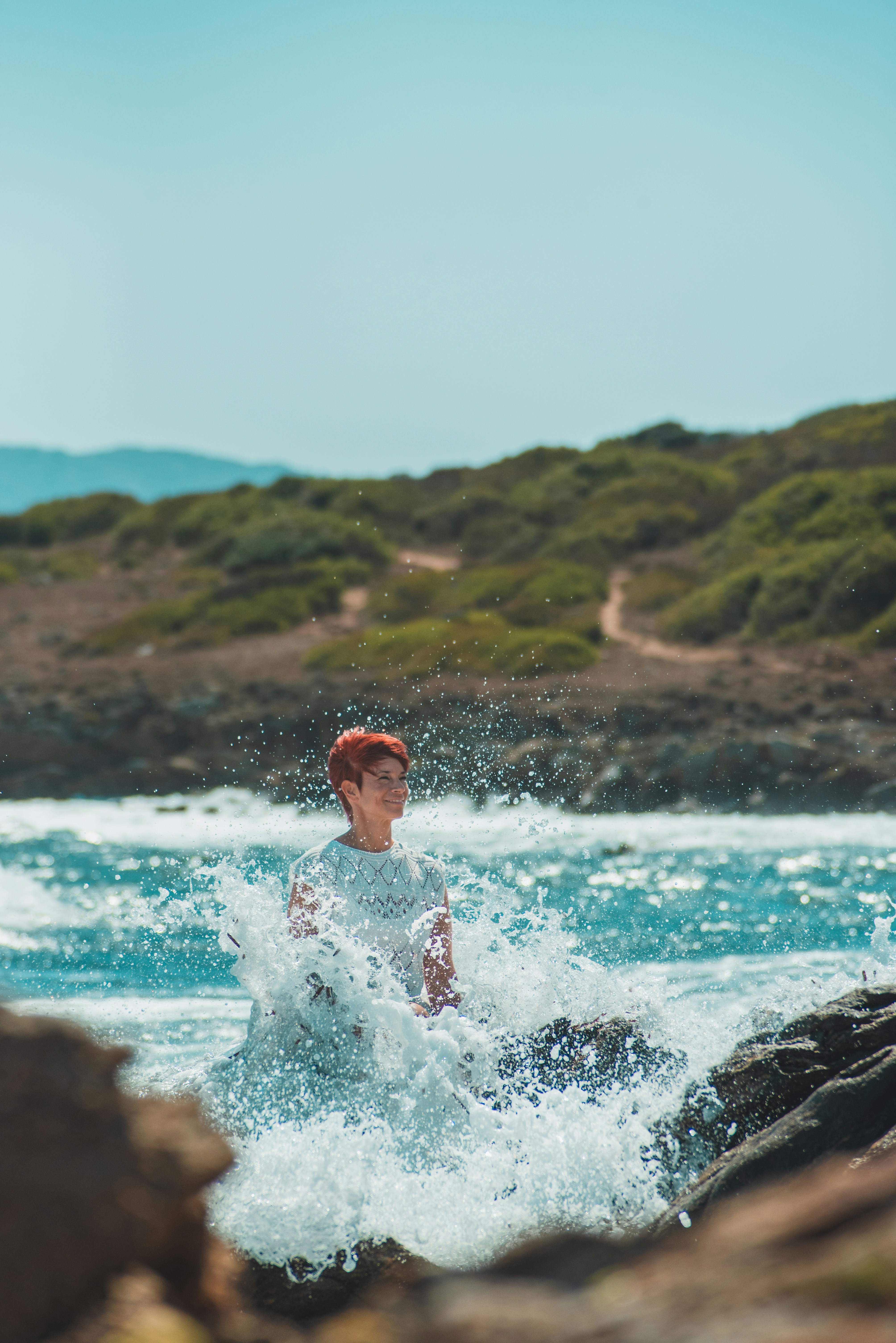 a man riding a wave on top of a surfboard
