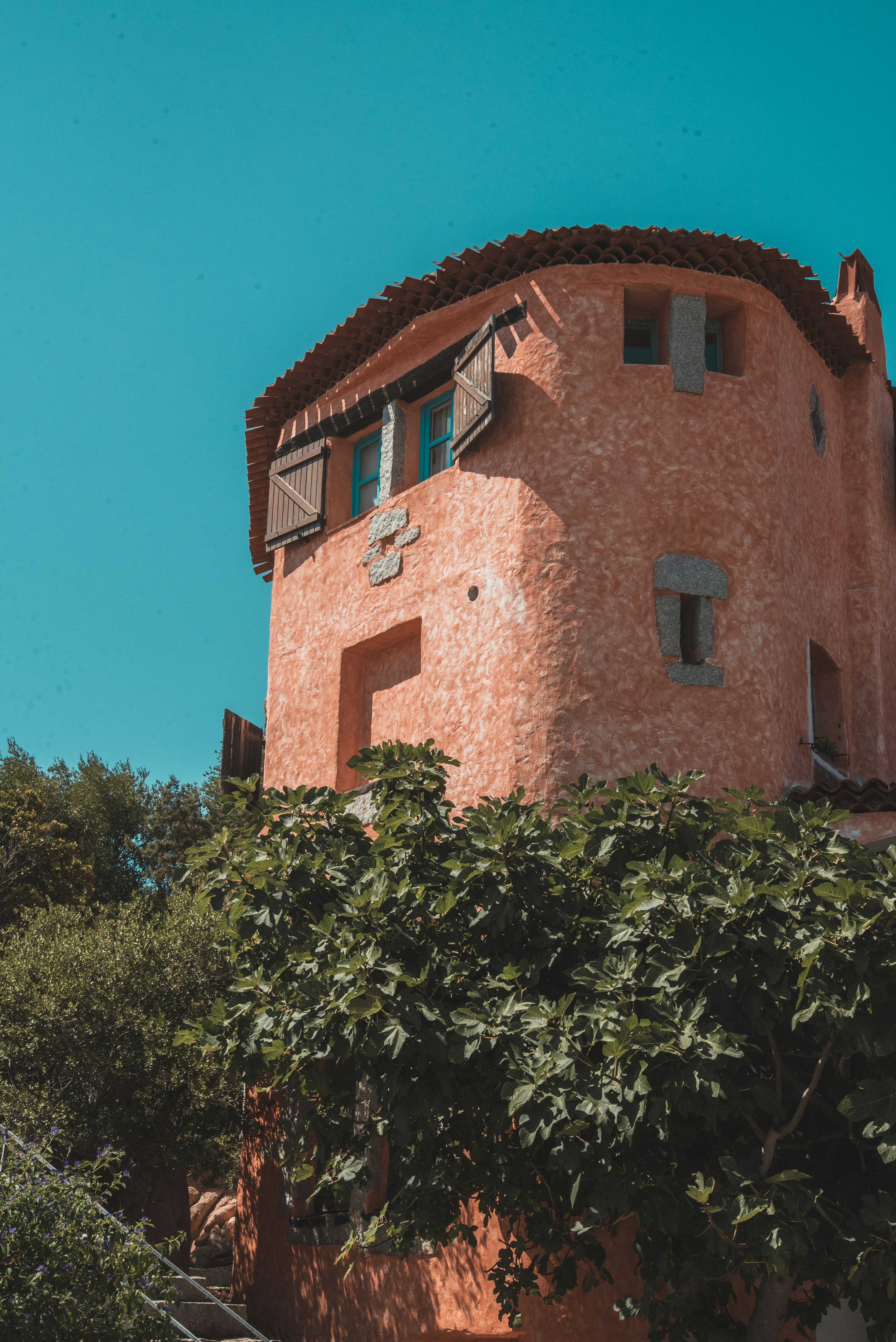 a tall building with a clock on the side of it