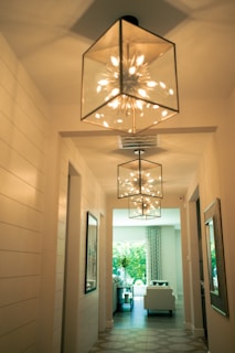 a hallway with a chandelier hanging from the ceiling