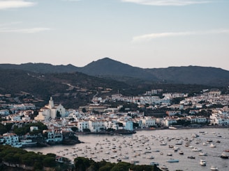 a harbor filled with lots of boats on top of a body of water