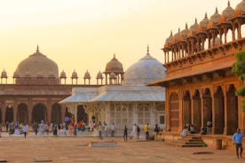 a group of people walking around a courtyard