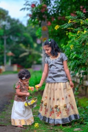 two little girls standing next to each other