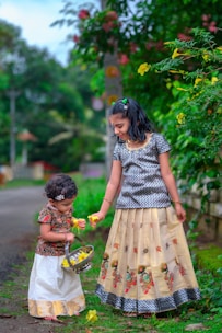 two little girls standing next to each other