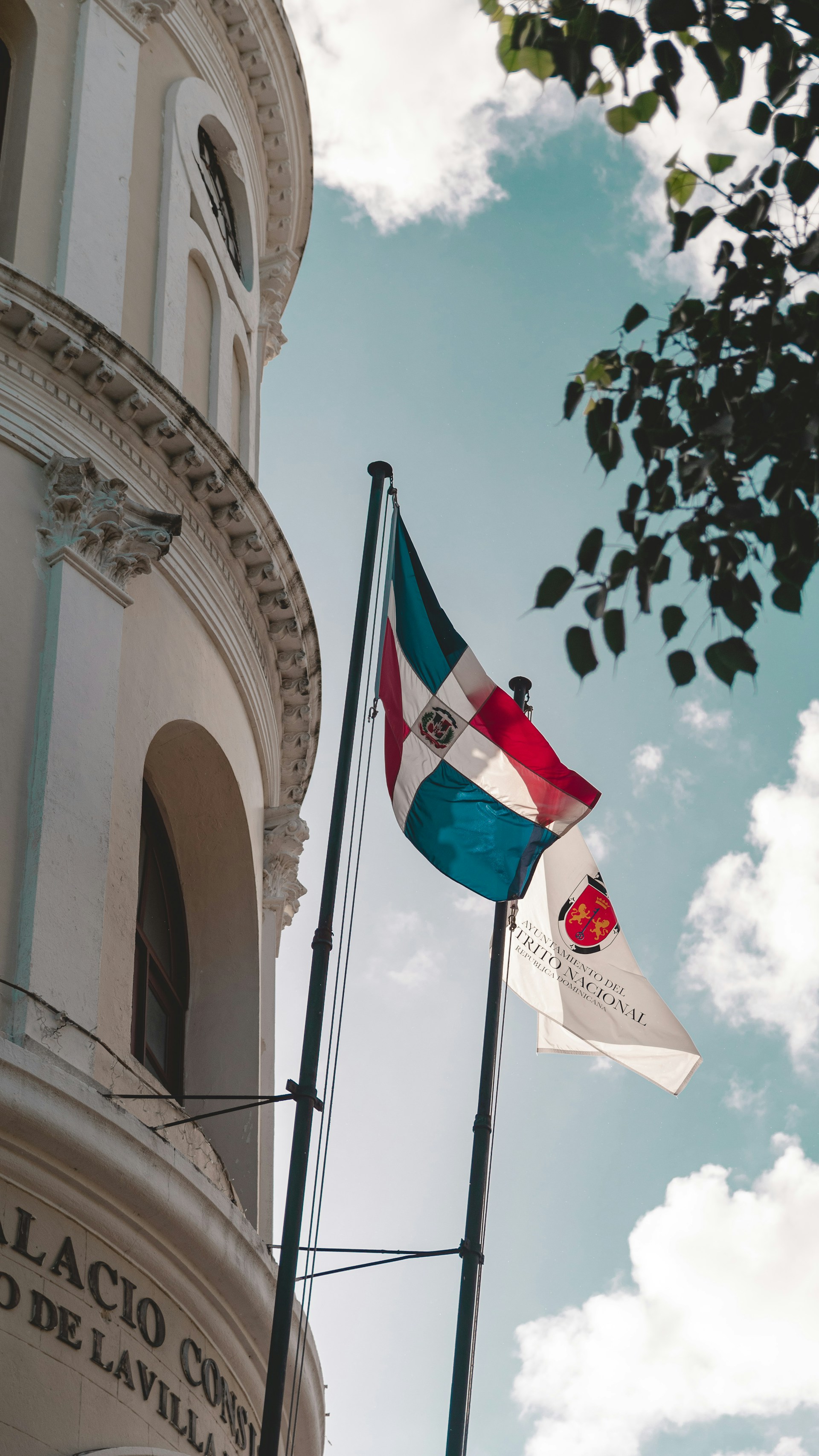 a flag is flying in front of a building