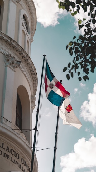 a flag is flying in front of a building
