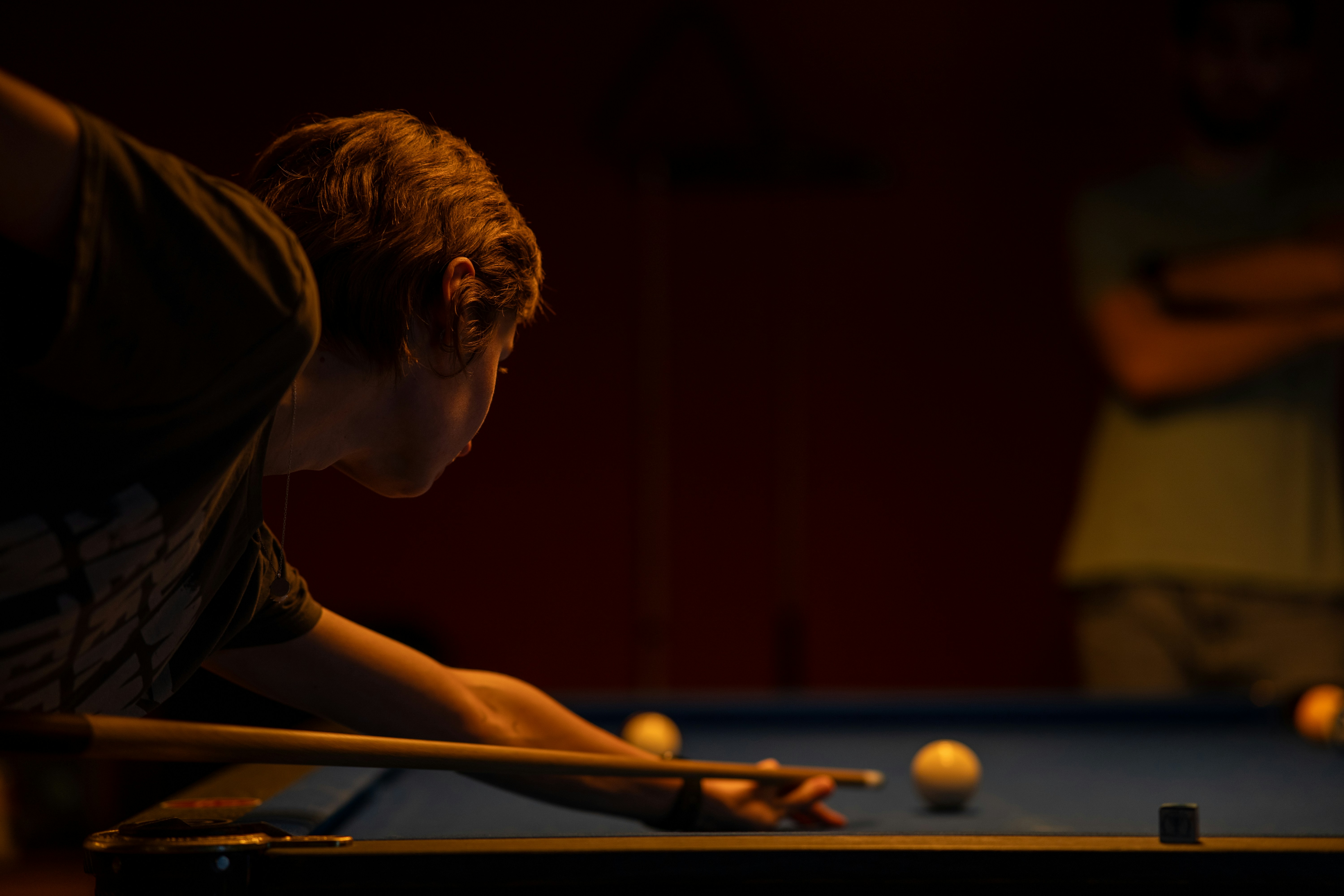 Eli Carter taking an opening break shot