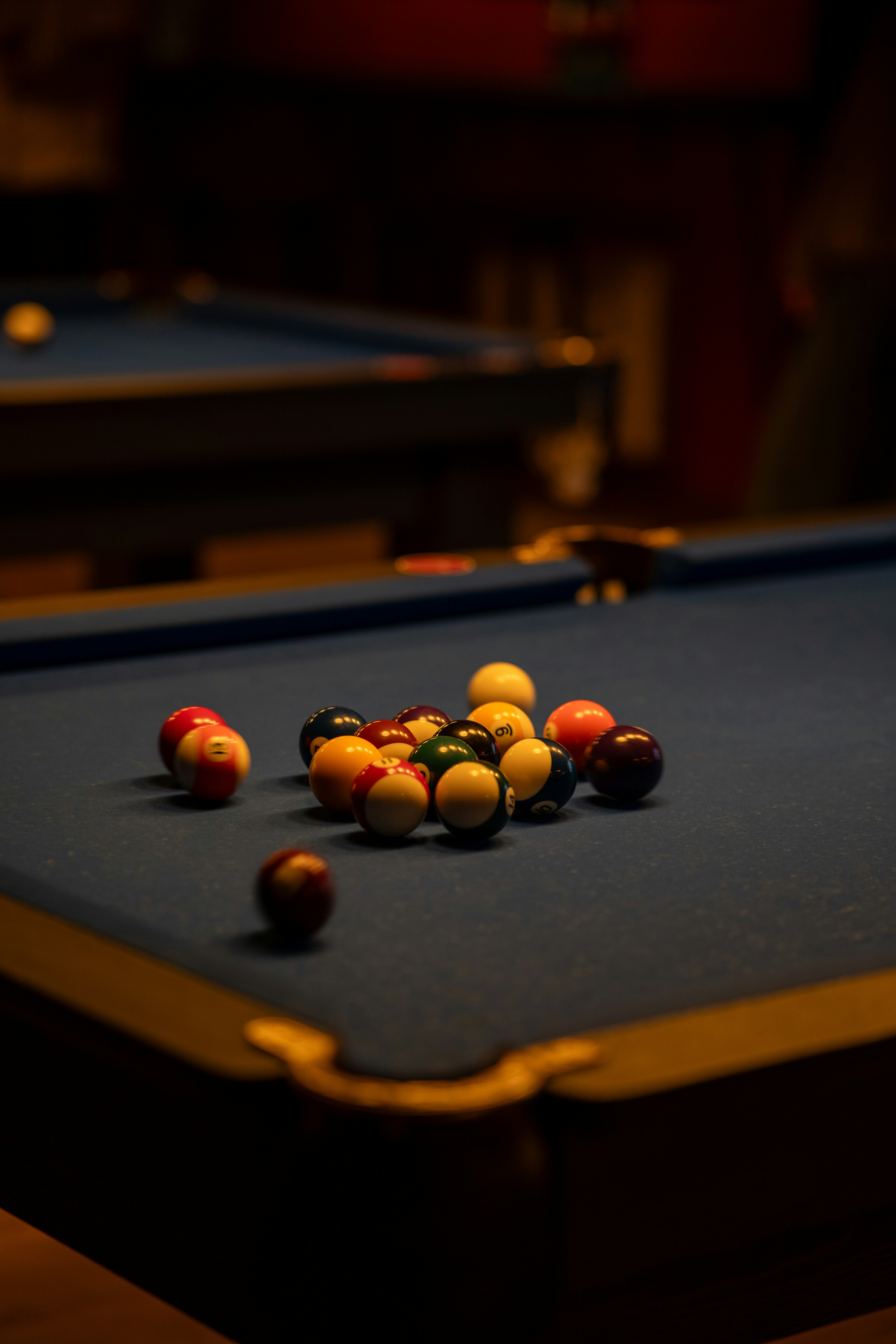 a pool table with a bunch of pool balls on it