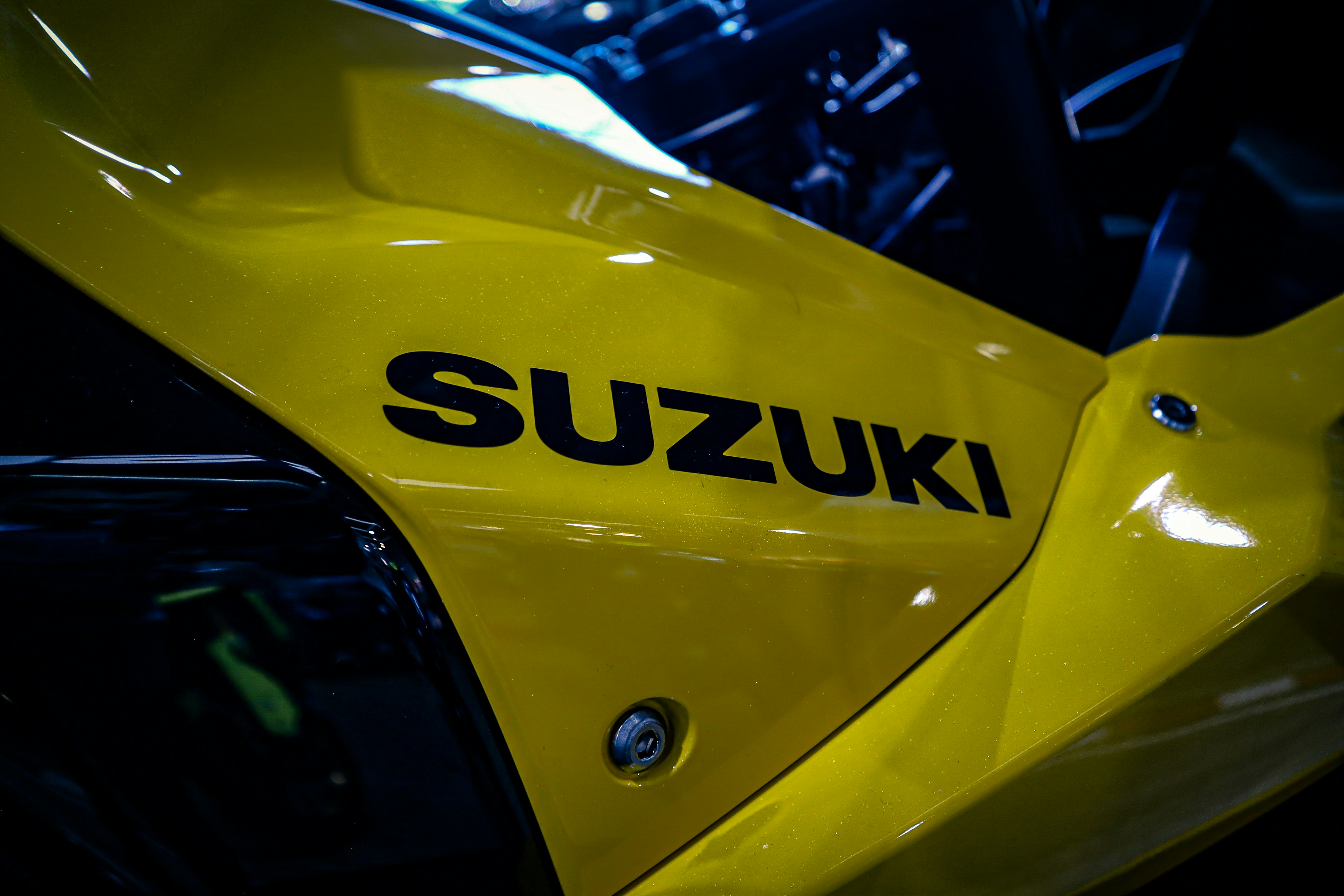 a close up of the suzuki logo on a motorcycle