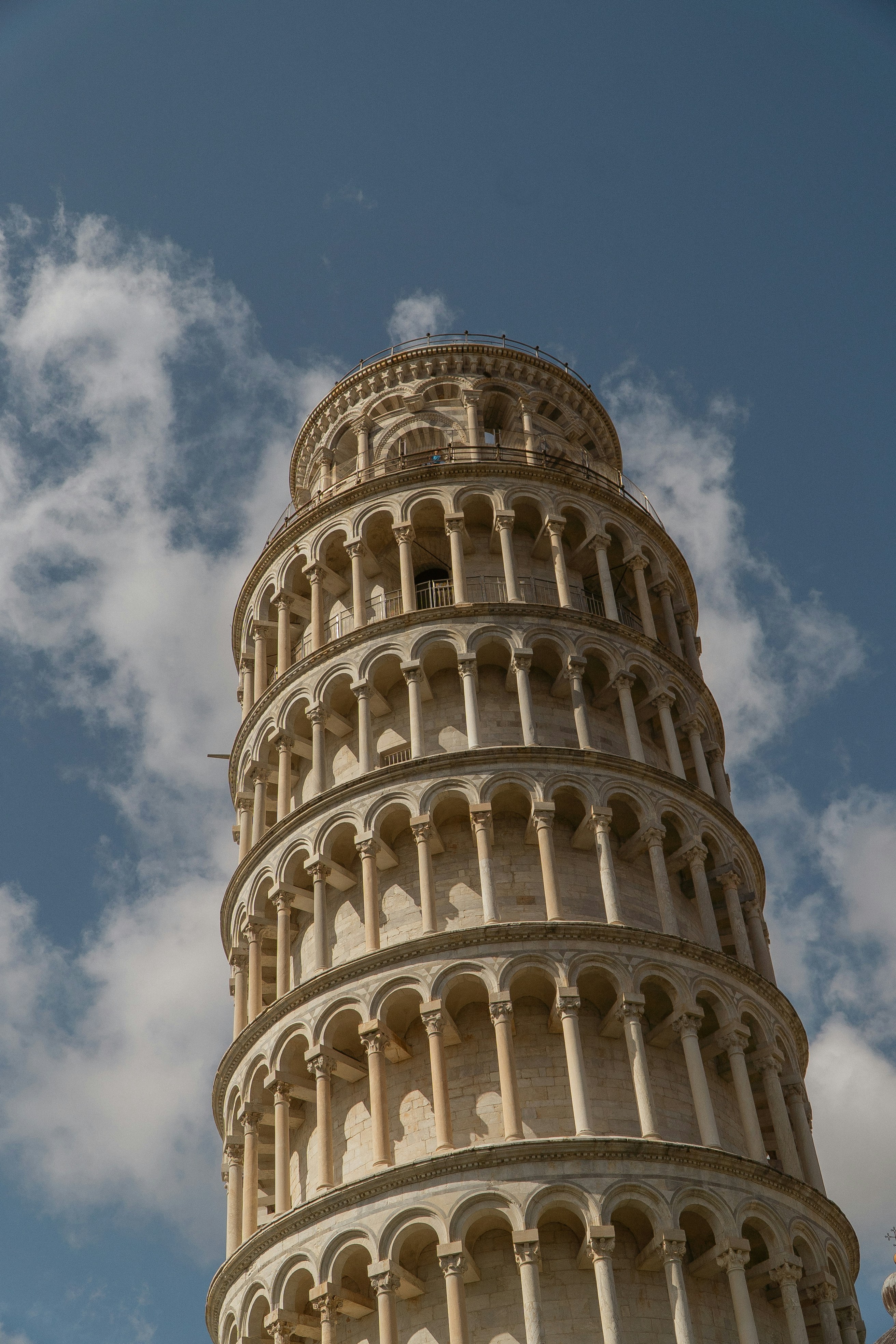 a very tall tower with a clock on it's side