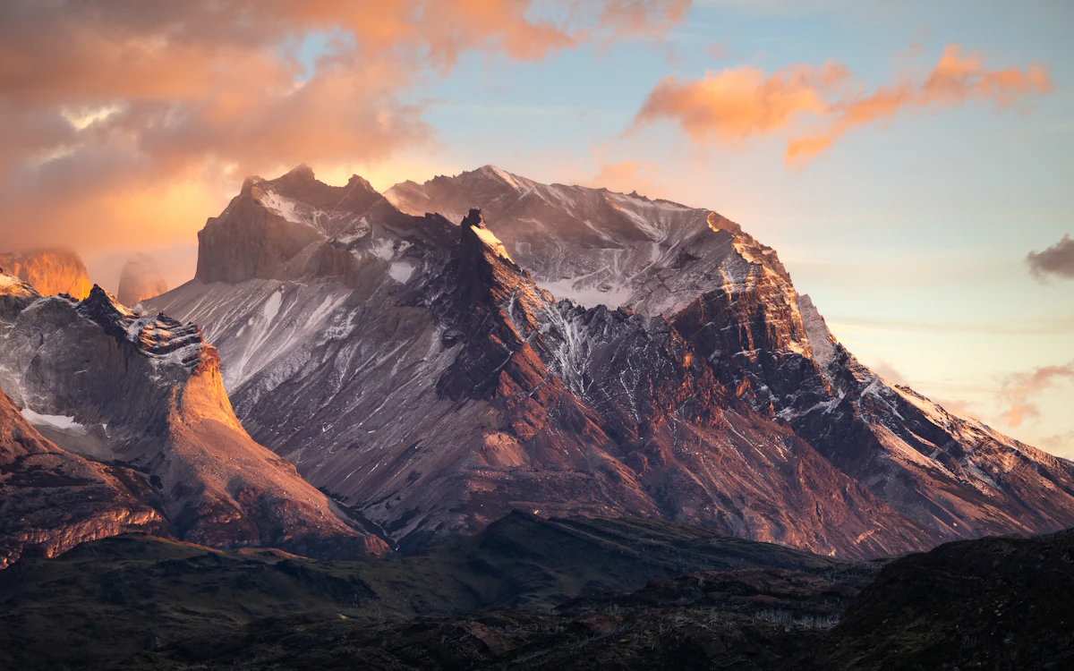 Panoramic snow-capped mountain range at sunrise