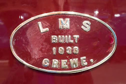 a close up of the emblem on a red car