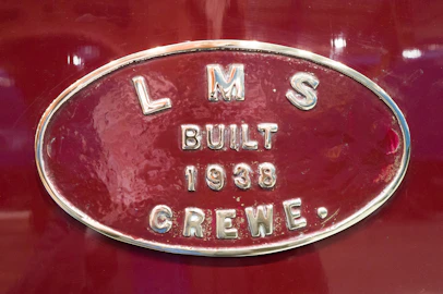 a close up of the emblem on a red car