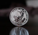 a close up of a coin on a table