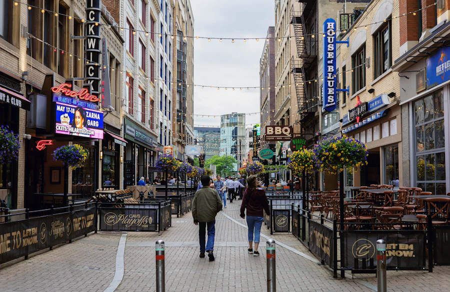 People walking along a busy commercial street