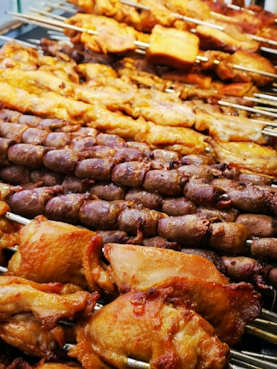 a bunch of food that is on a grill