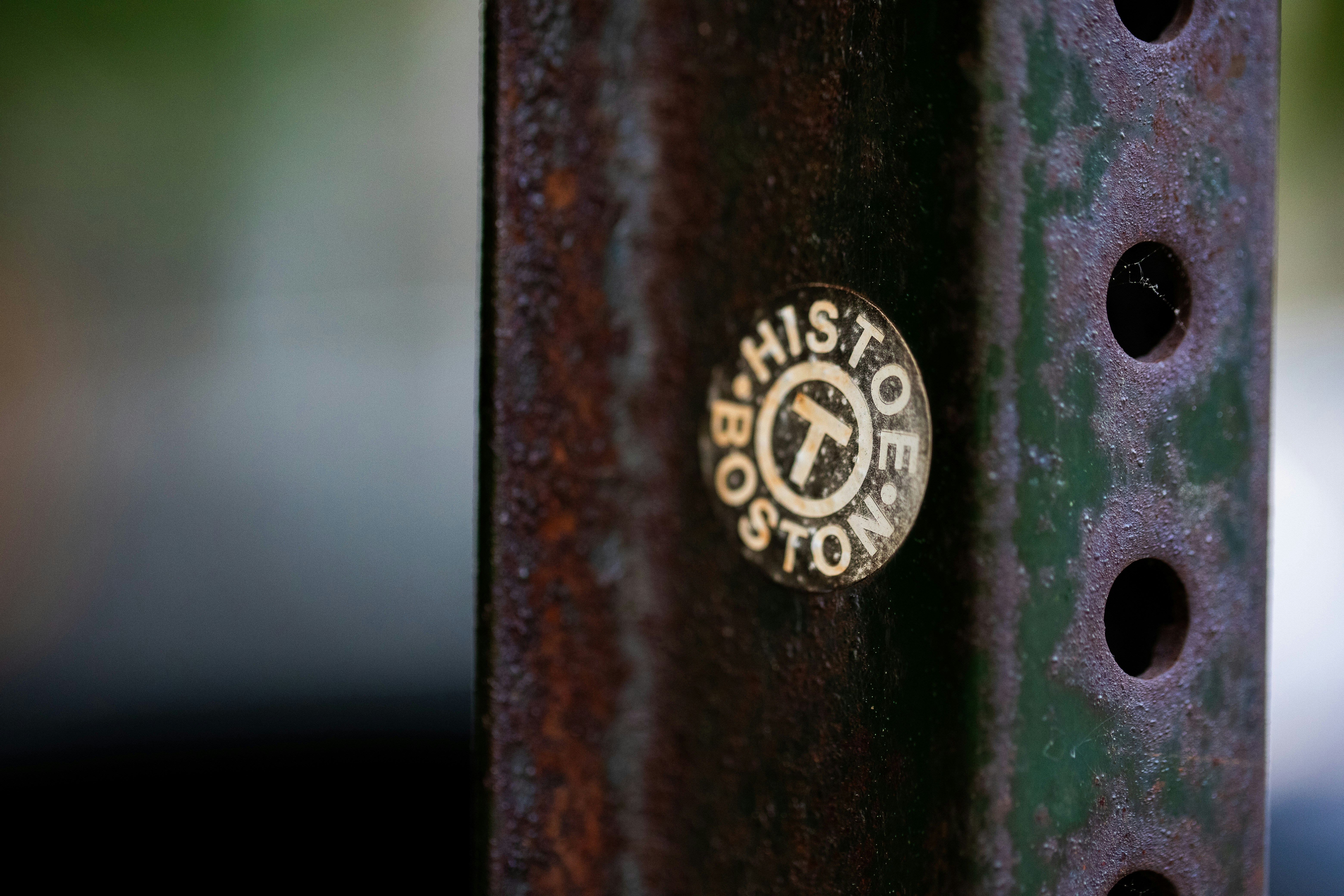 a close up of a metal pole with a sticker on it