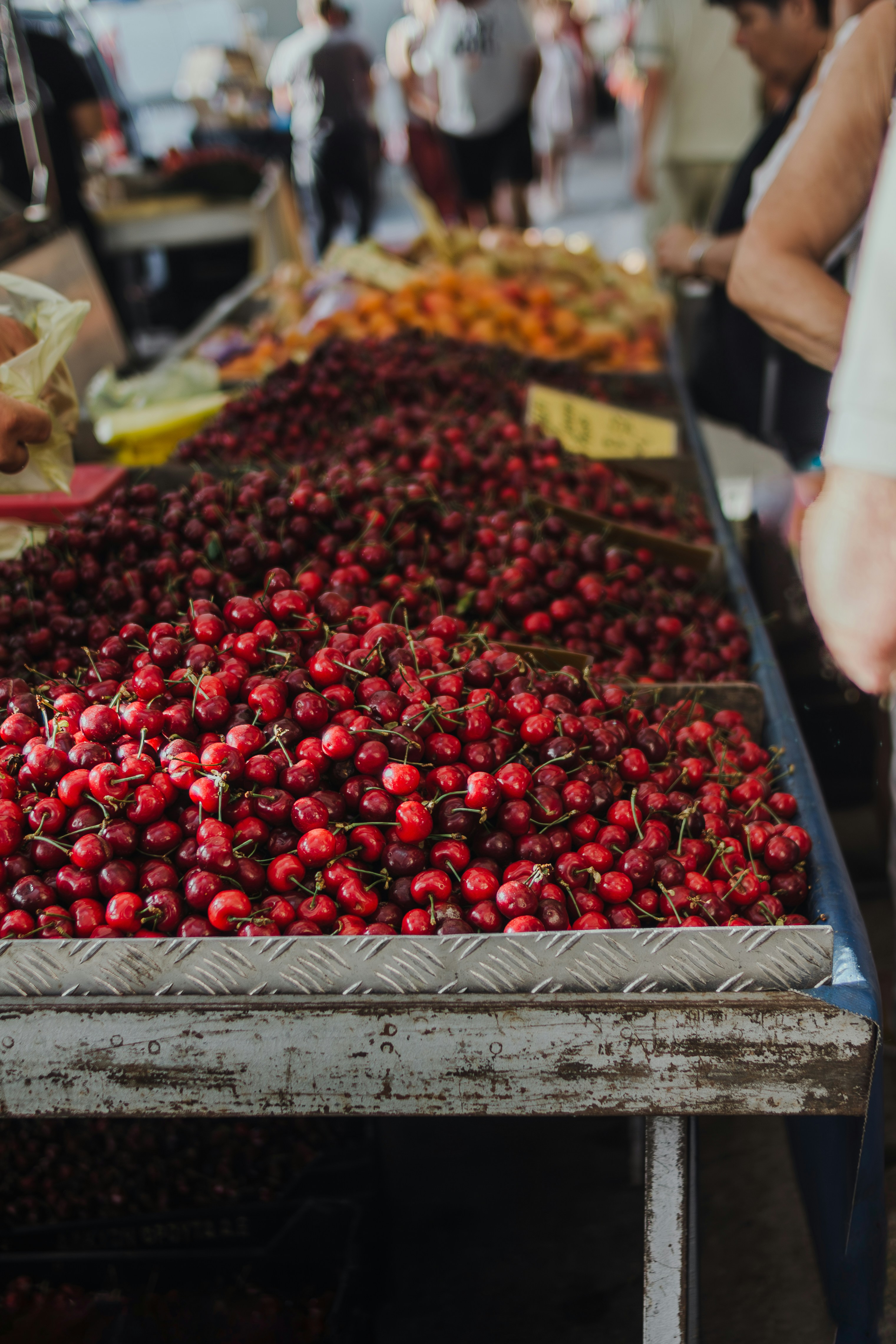 a bunch of strawberries on a table at a market