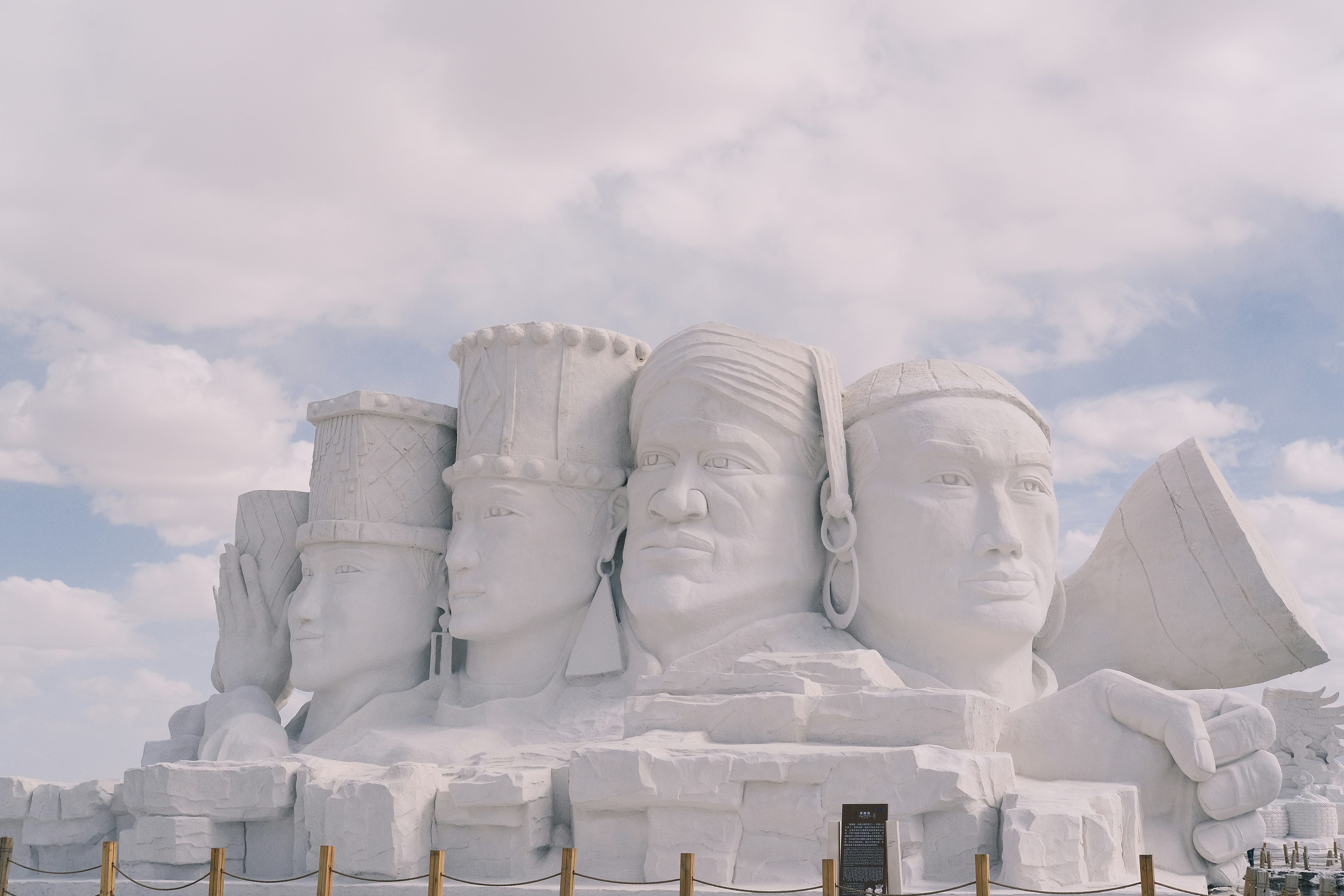 A large snow sculpture of a group of people