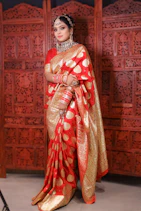 a woman in a red and gold sari