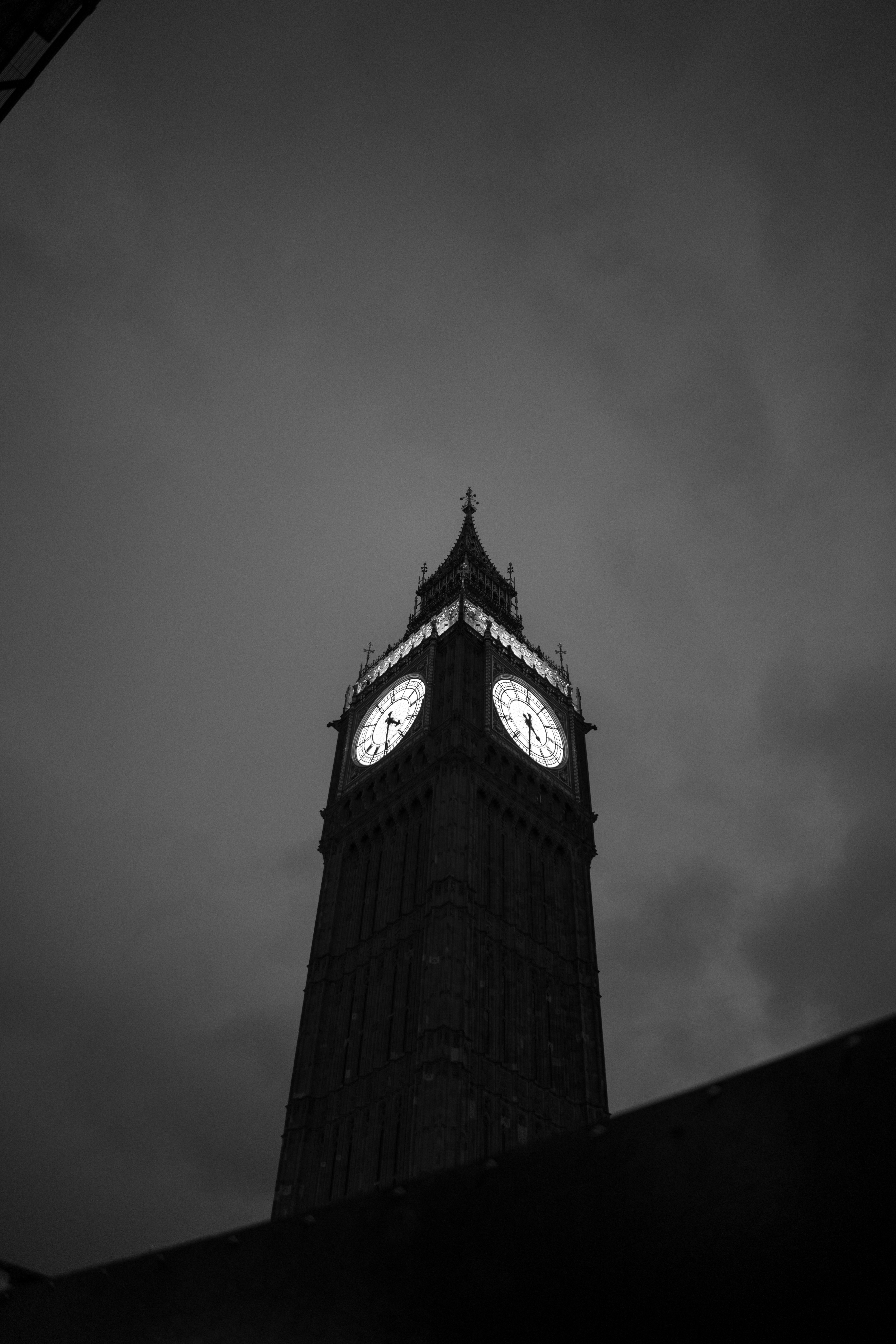 a black and white photo of a clock tower