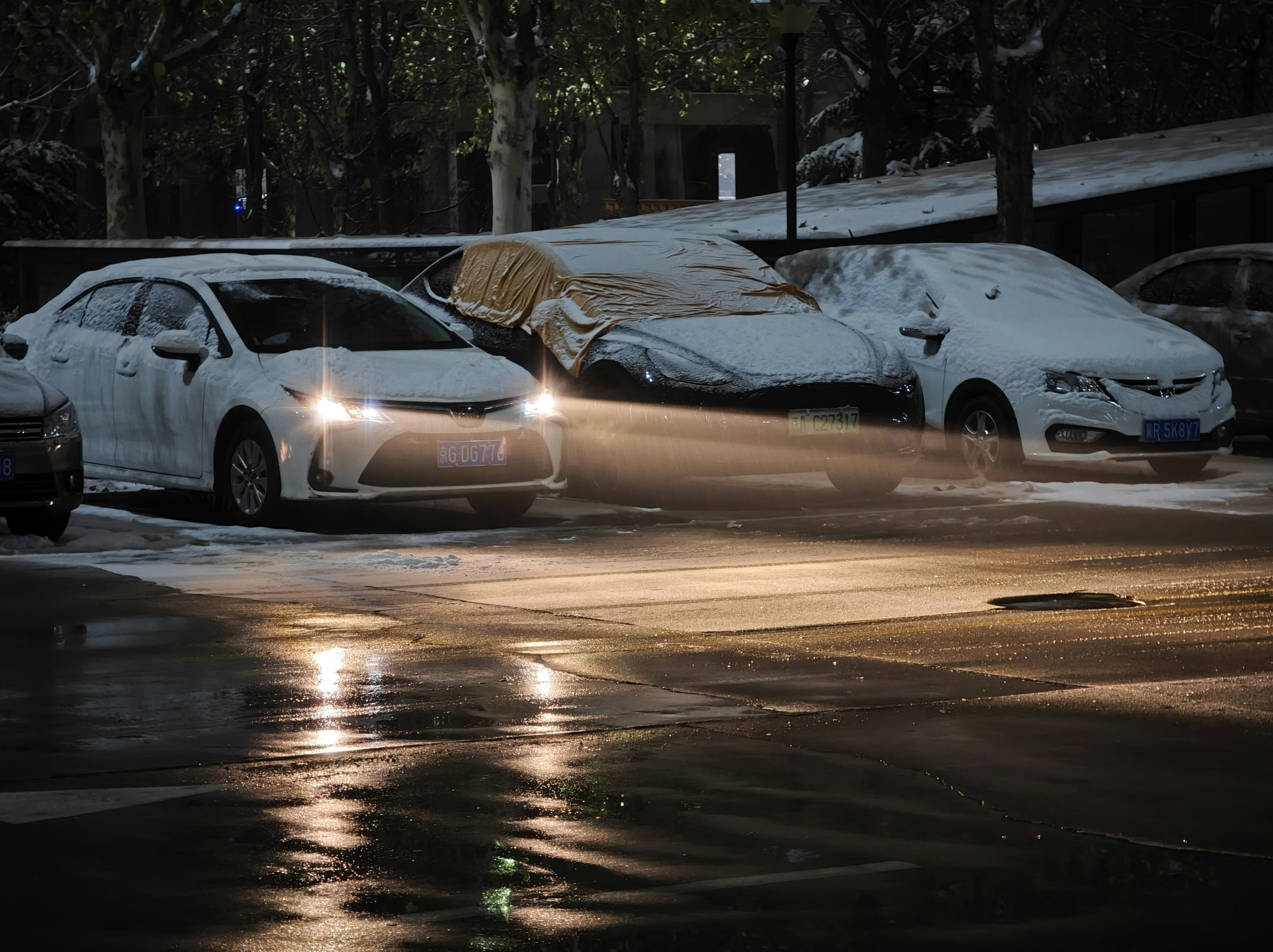 a couple of cars that are sitting in the street