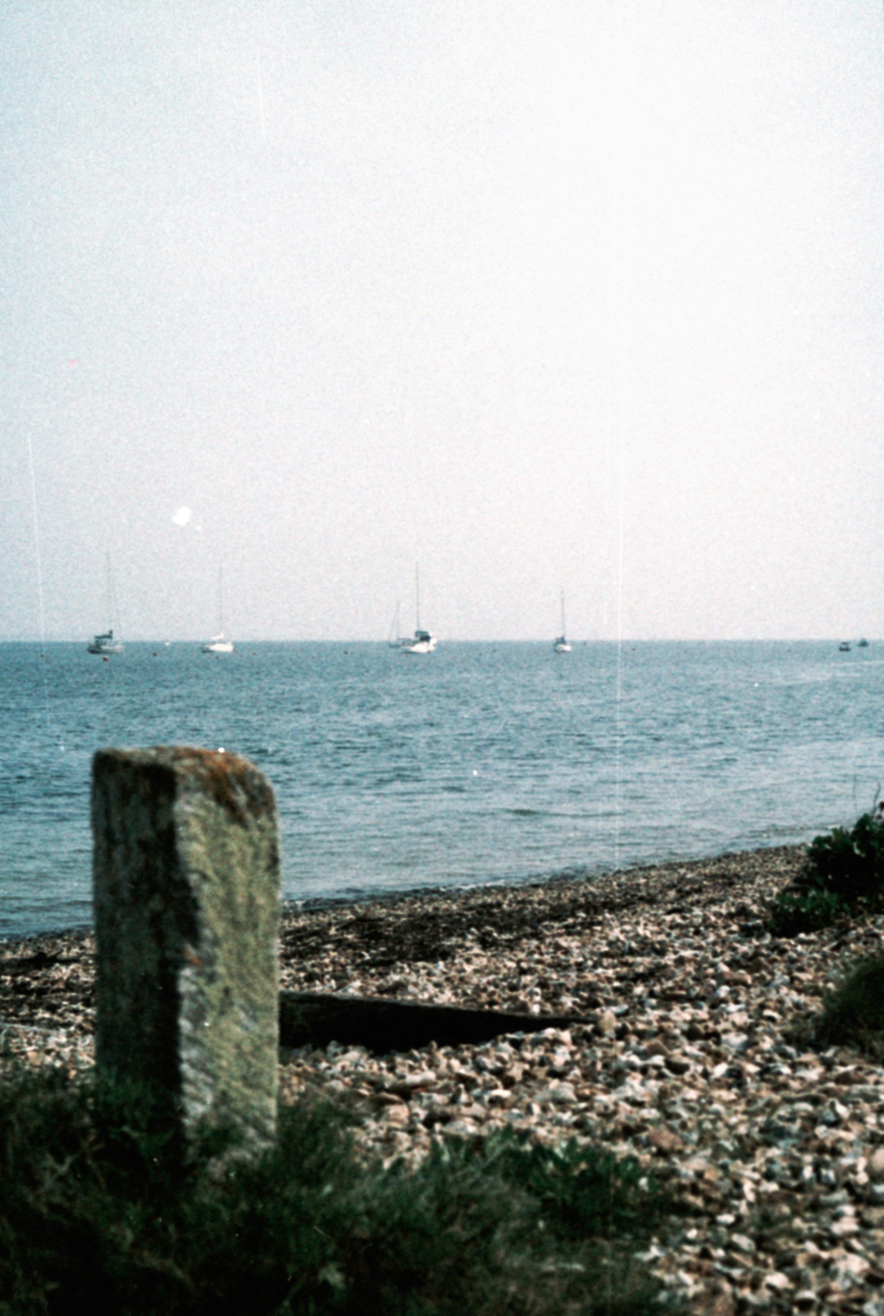 a body of water with boats in the distance