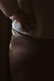 a close up of a person wearing a skirt