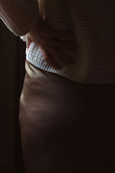a close up of a person wearing a skirt
