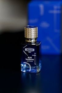 a bottle of blue taliskman on a table