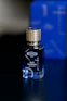 a bottle of blue taliskman on a table