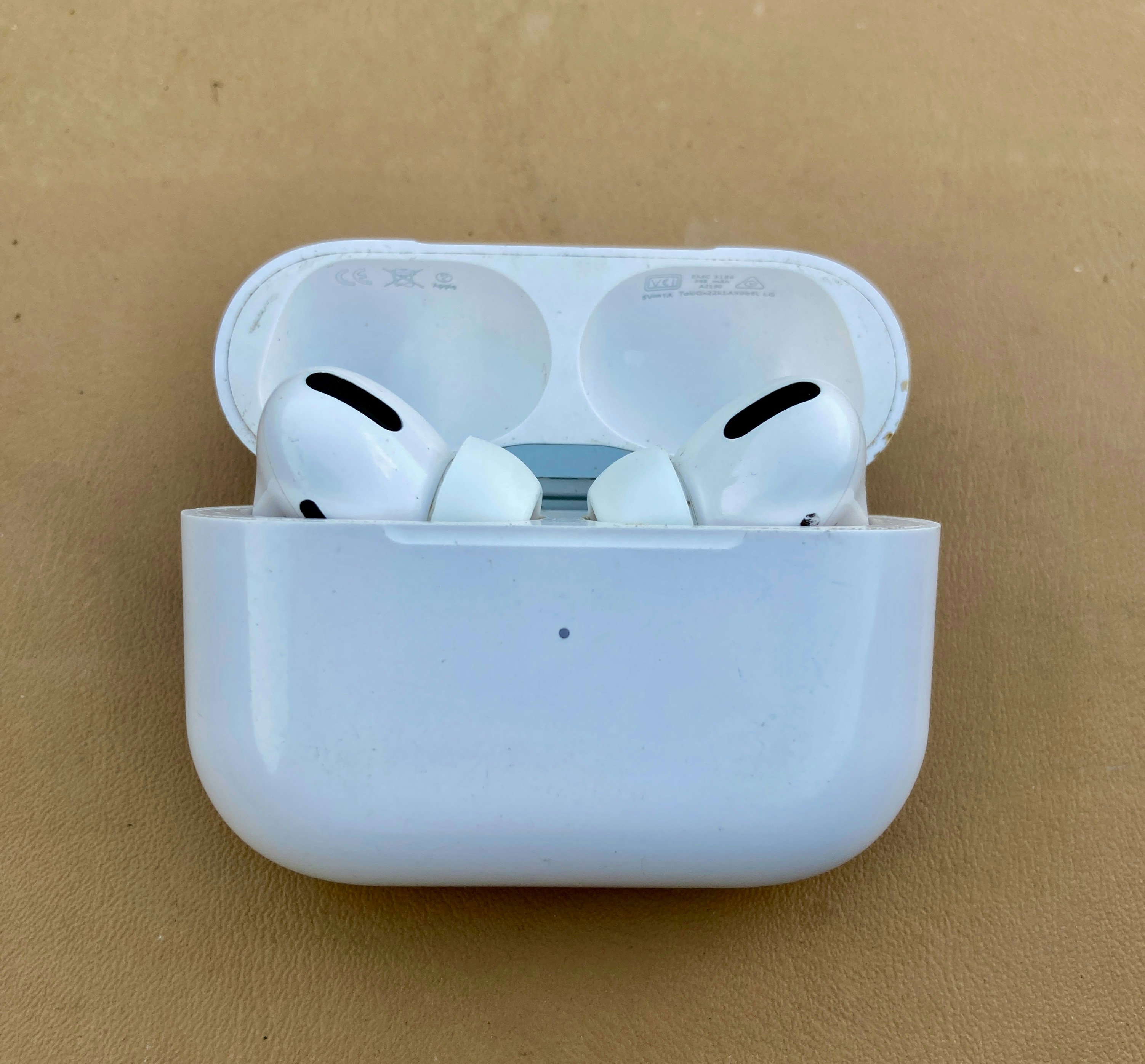 White Apple AirPods Pro in charging case
