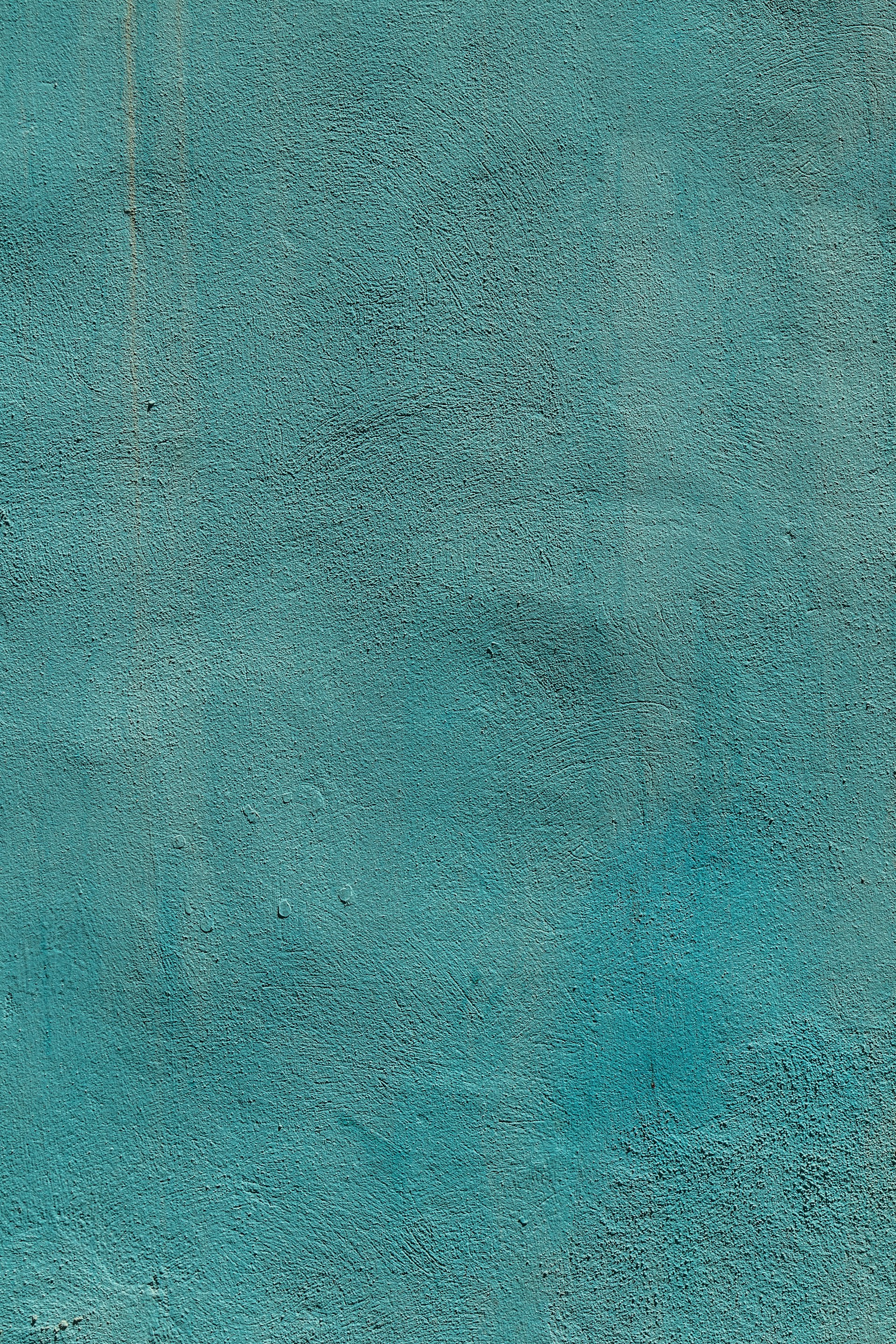 a blue wall that has a clock on it