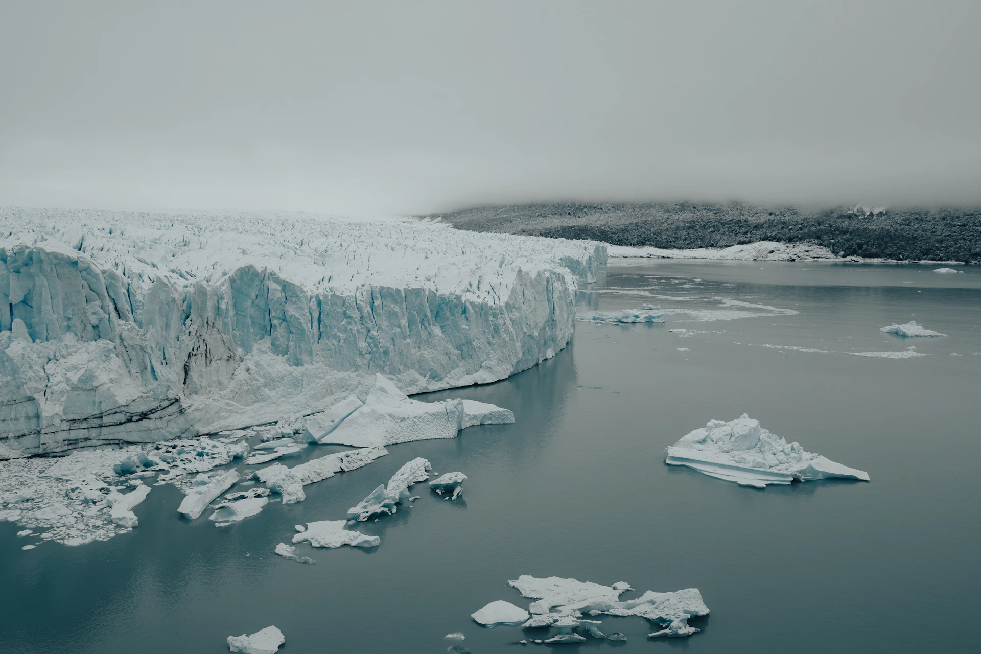 a large iceberg in the middle of a body of water