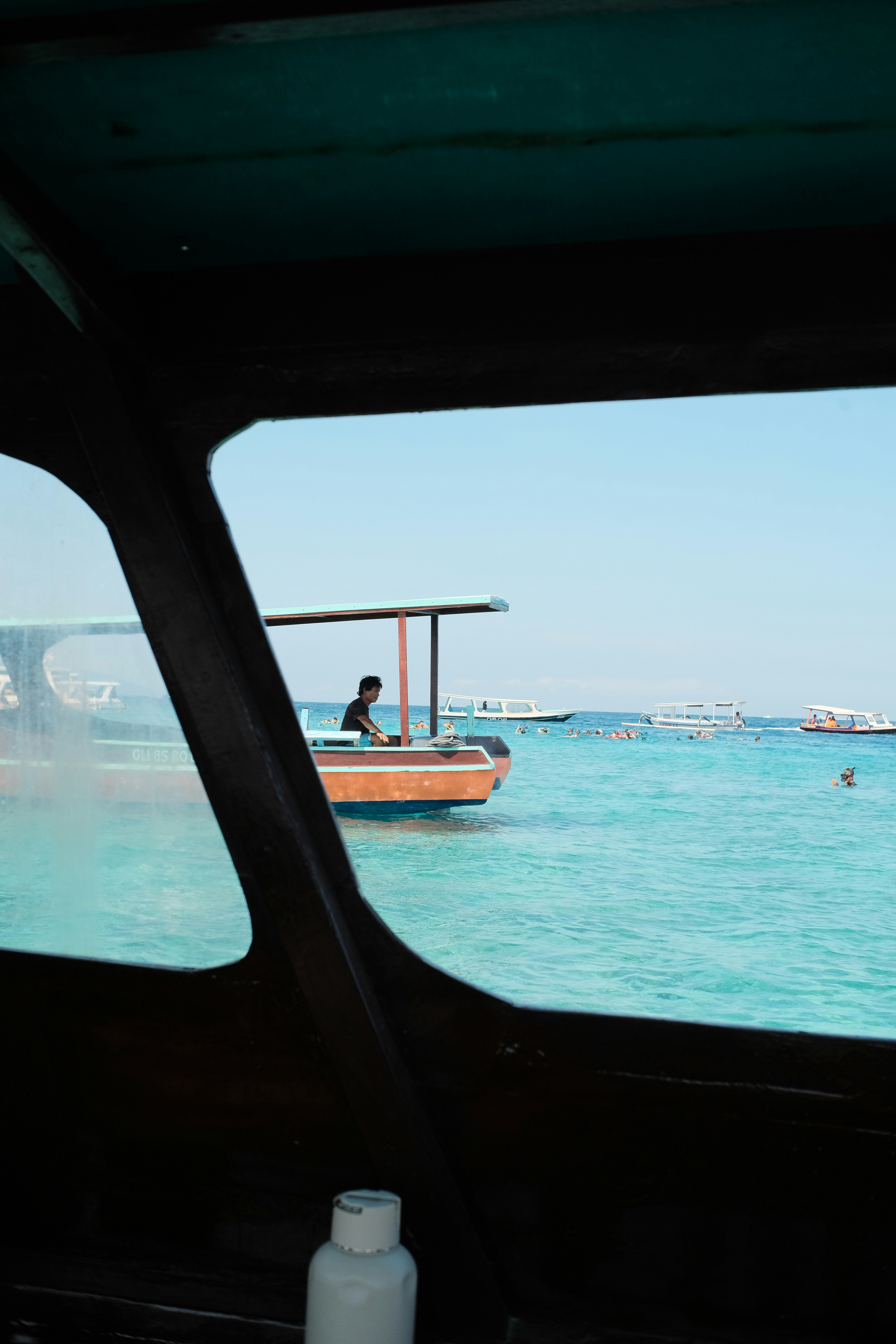 a small boat in the middle of a body of water