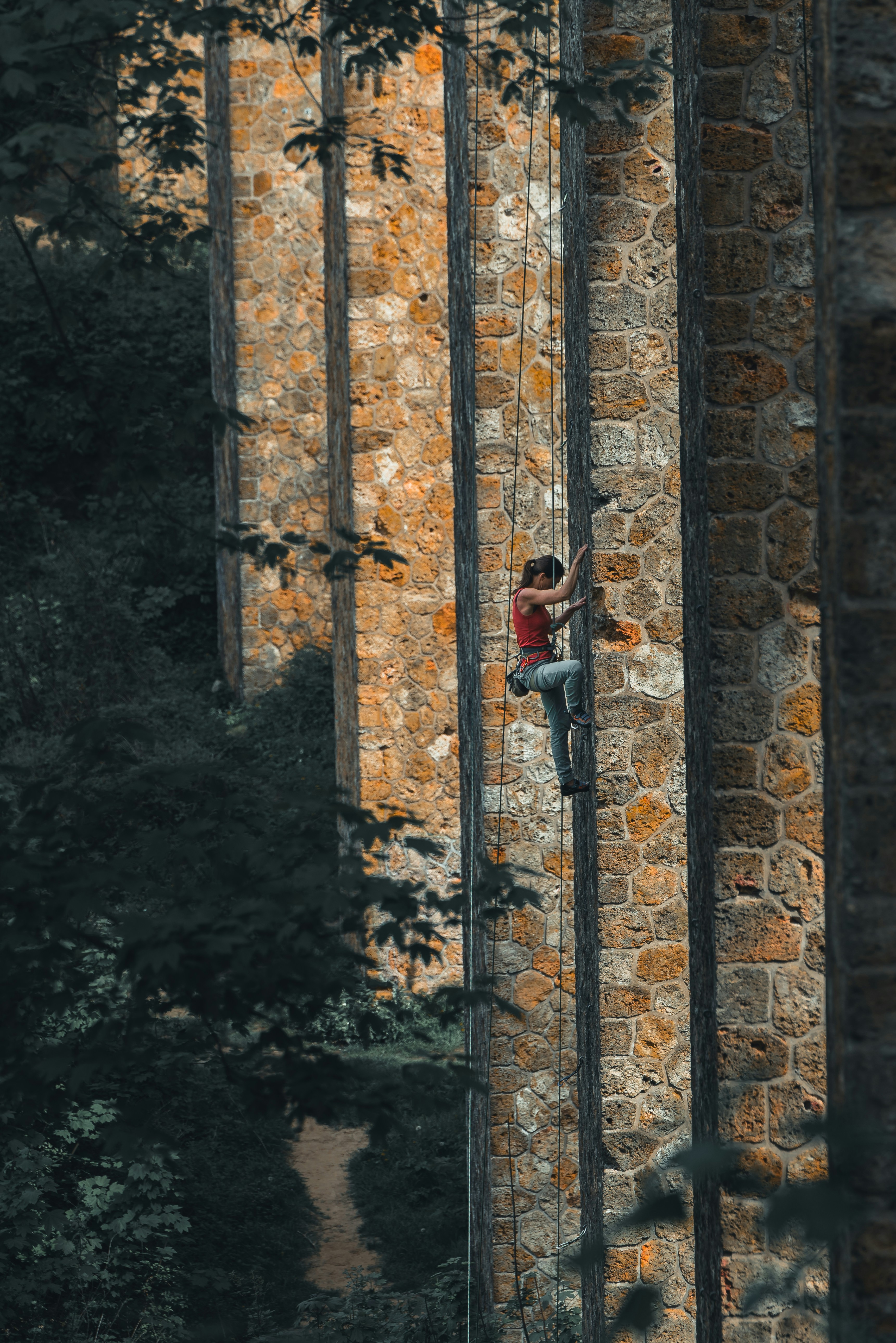 A climber working a bouldering problem