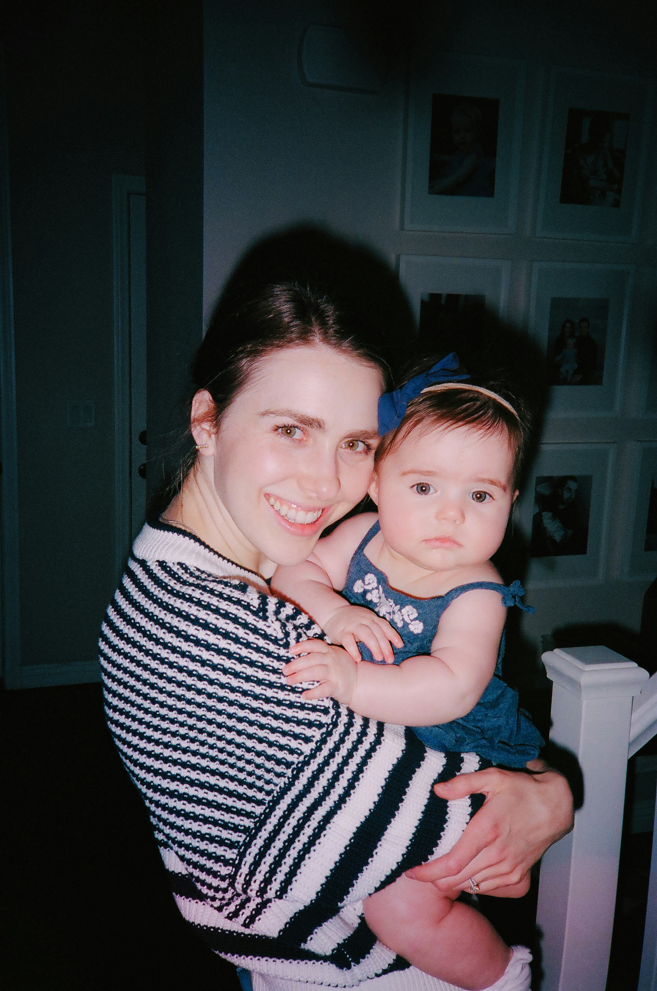 a woman holding a baby in her arms