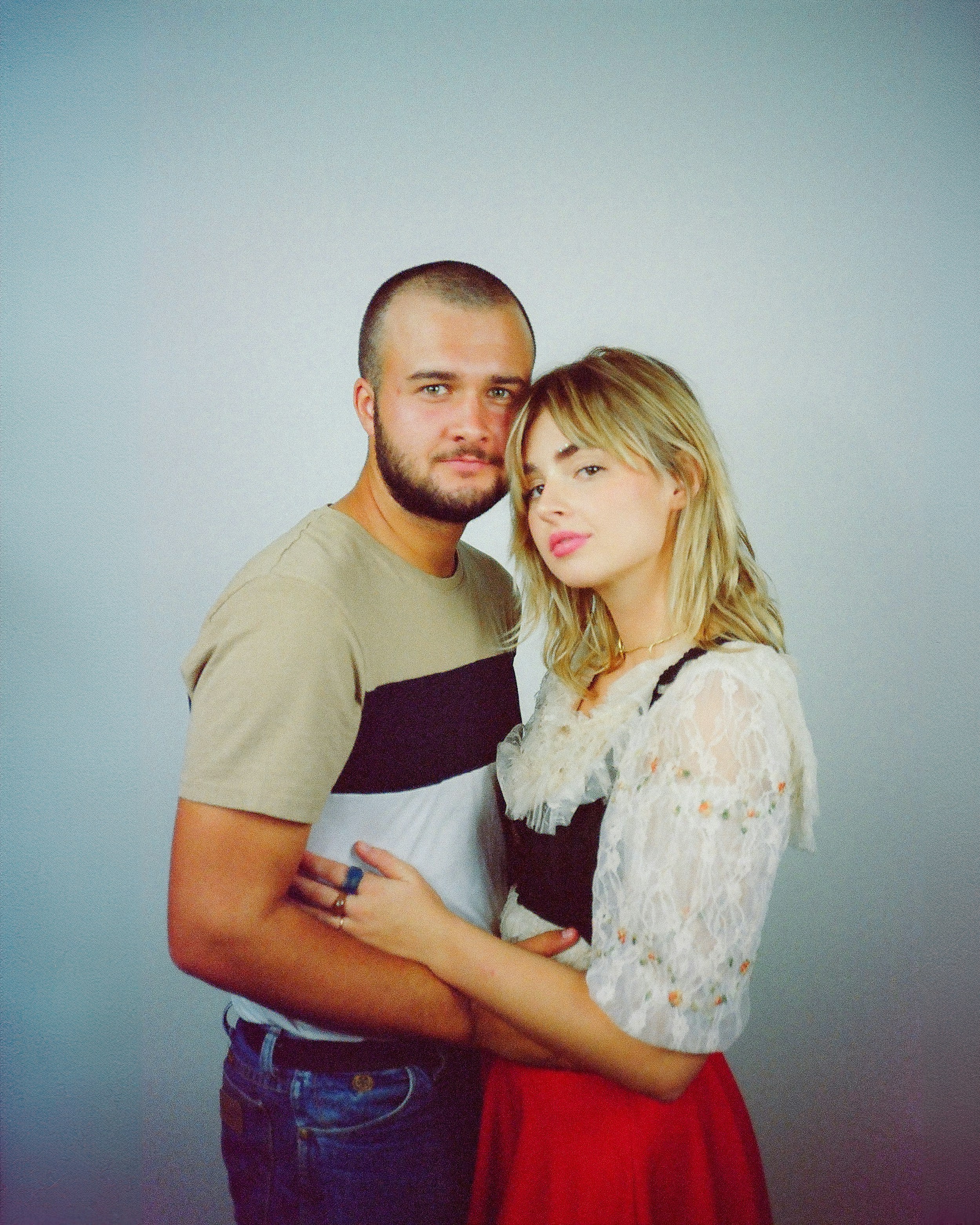 A man and a woman standing next to each other photo – Free Woman Image ...