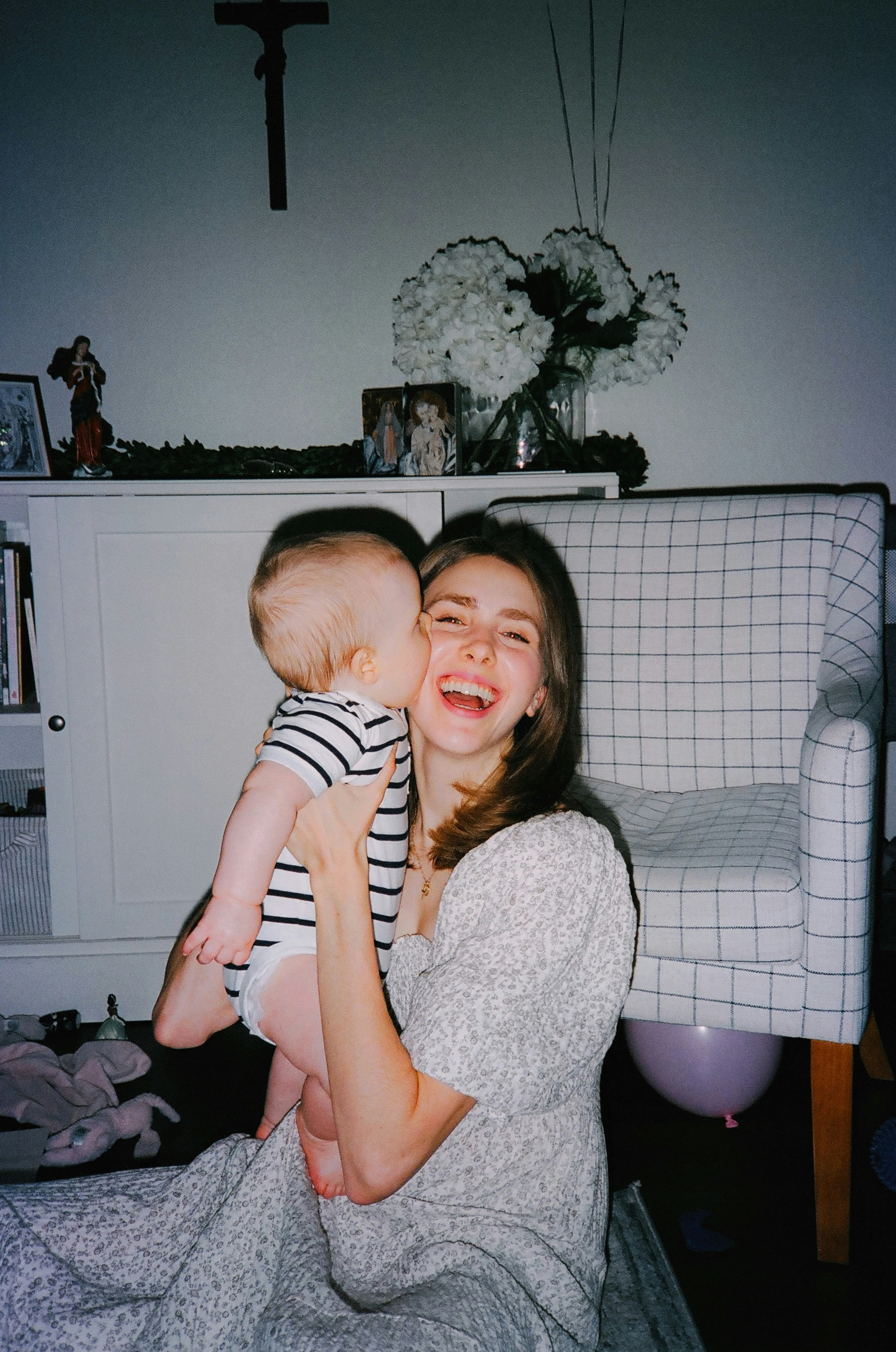 a woman holding a baby in her arms