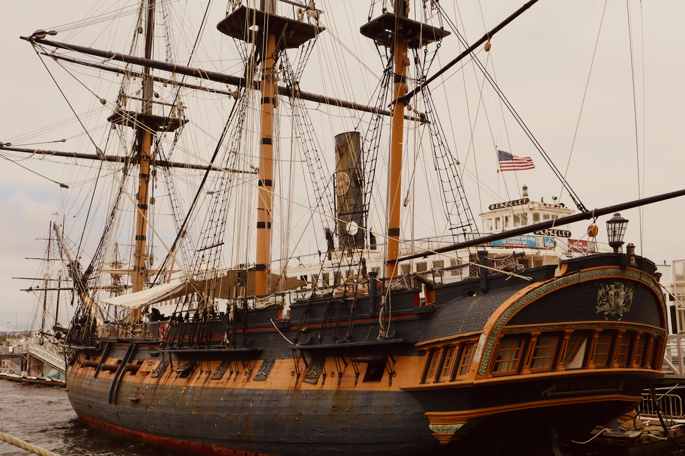 Wooden pirate ship docked in a harbor