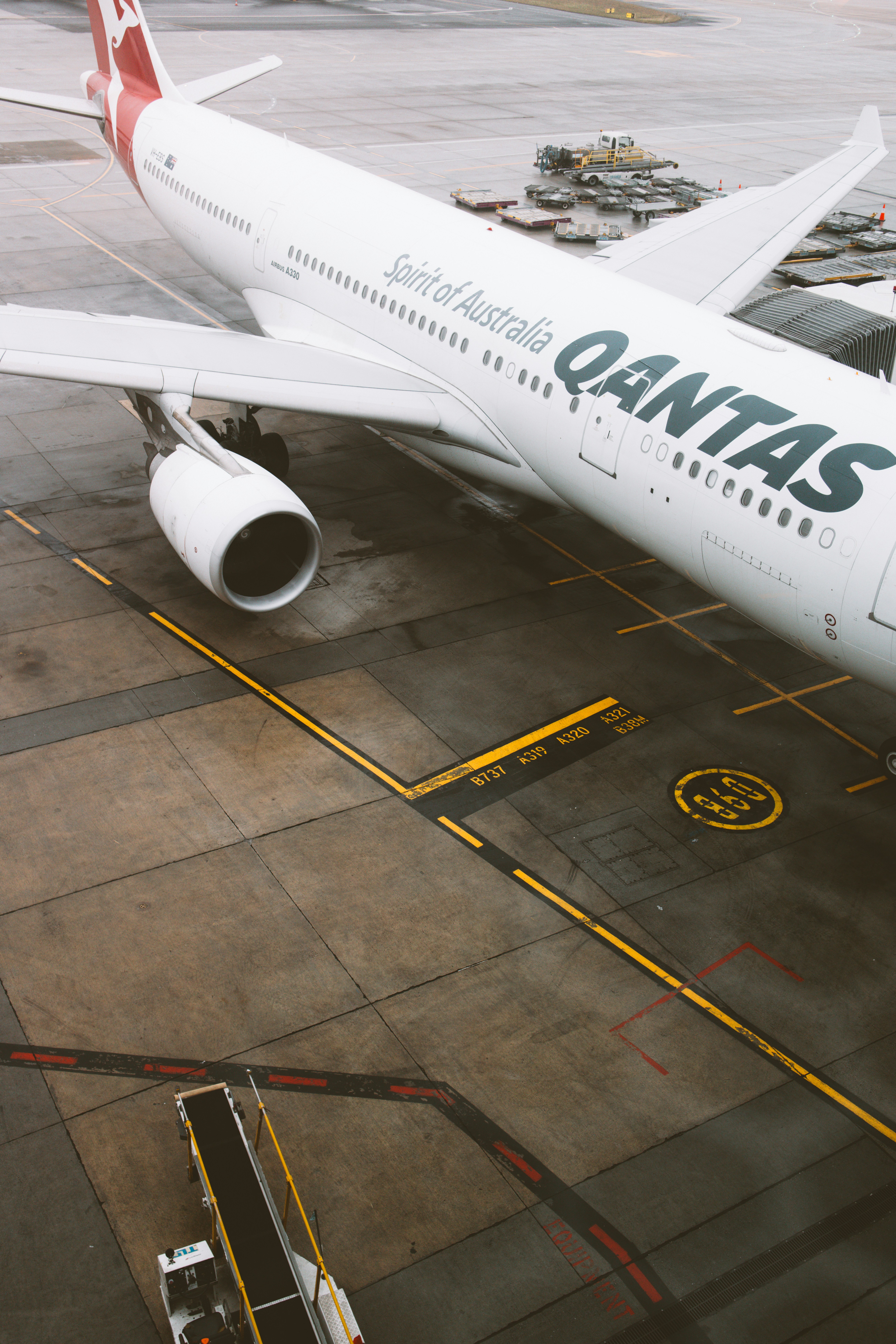 a large passenger jet sitting on top of an airport tarmac
