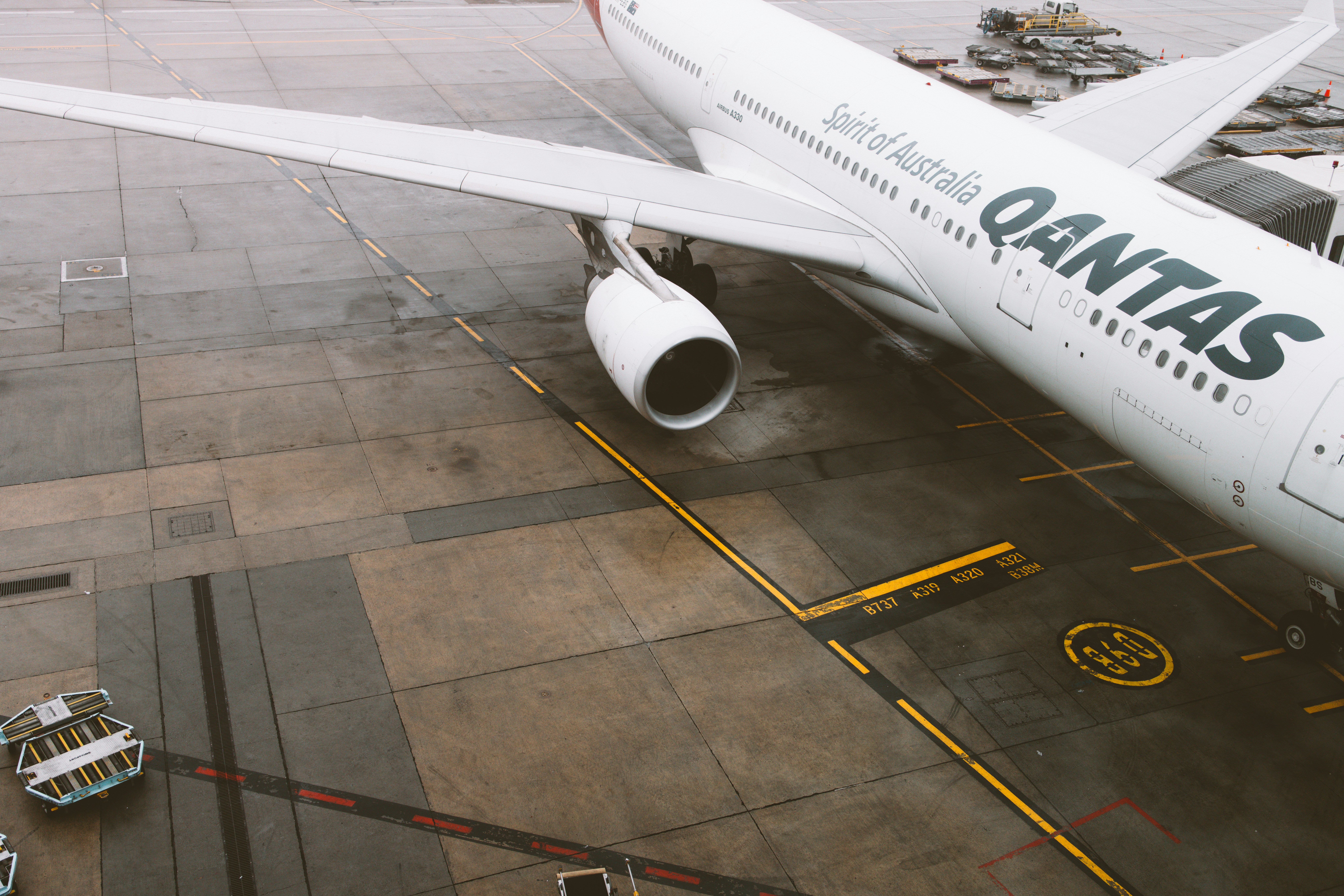 a large passenger jet sitting on top of an airport tarmac