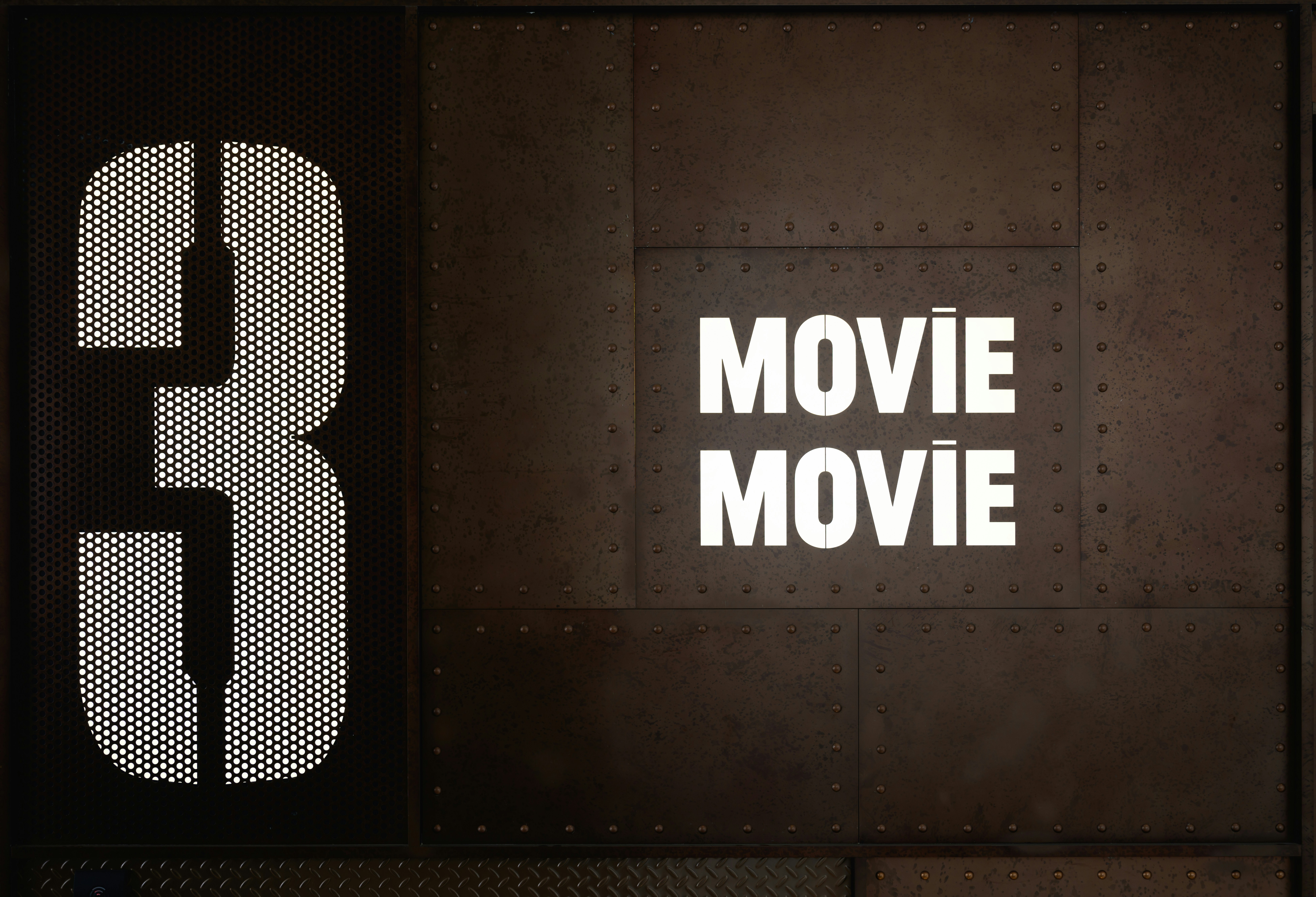 A huge number 3 on a metal plate