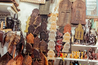 a store filled with lots of wooden carved items